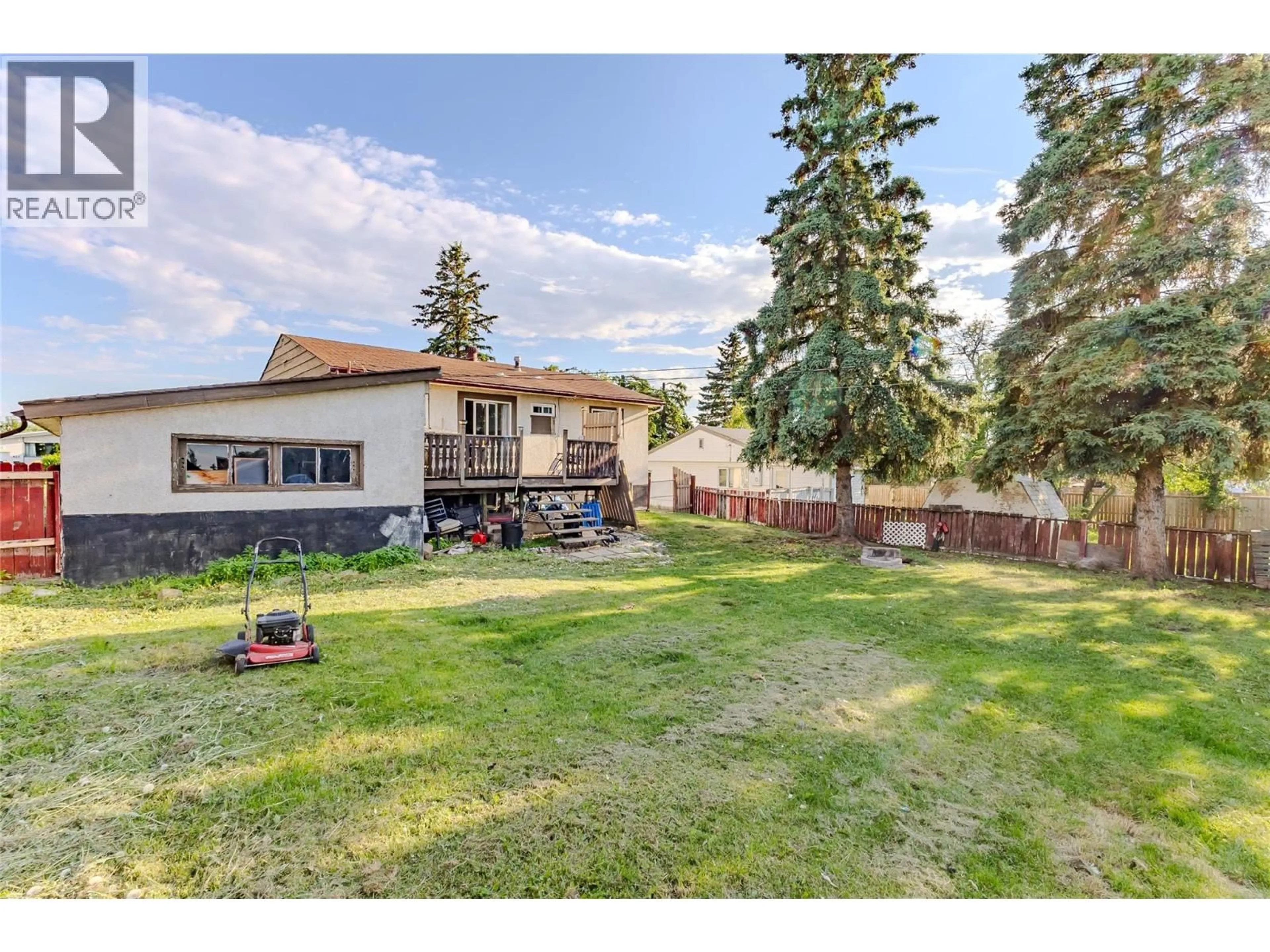A pic from outside/outdoor area/front of a property/back of a property/a pic from drone, mountain view for 416 96 AVENUE, Dawson Creek British Columbia V1G1K4