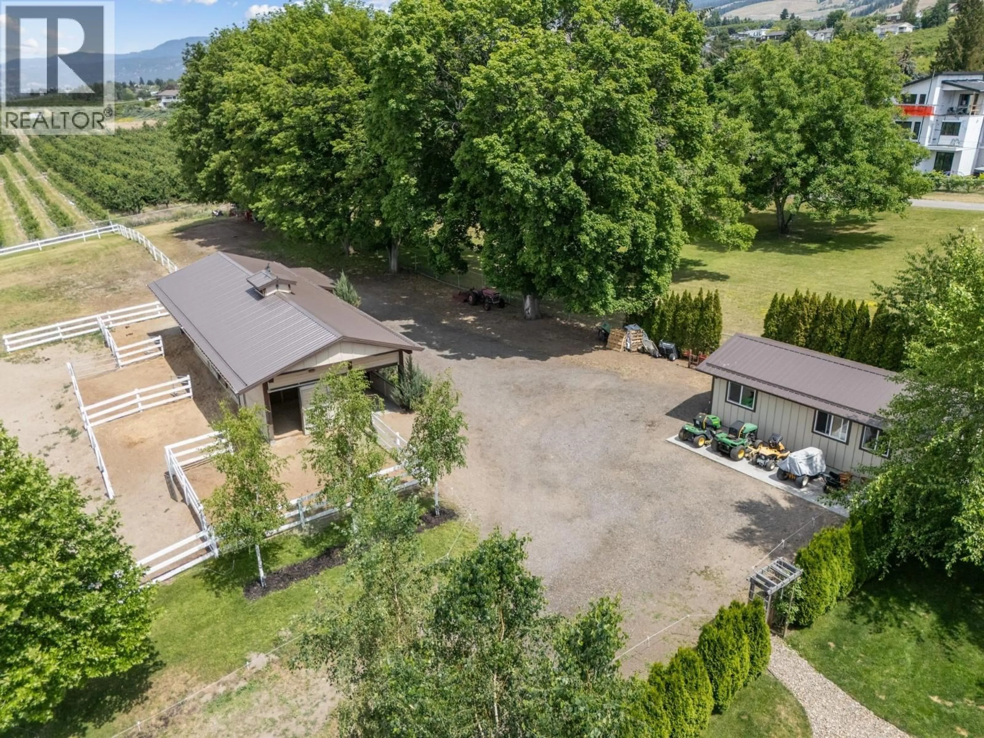 A pic from outside/outdoor area/front of a property/back of a property/a pic from drone, mountain view for 1052 WEBSTER ROAD, Kelowna British Columbia V1P1C2