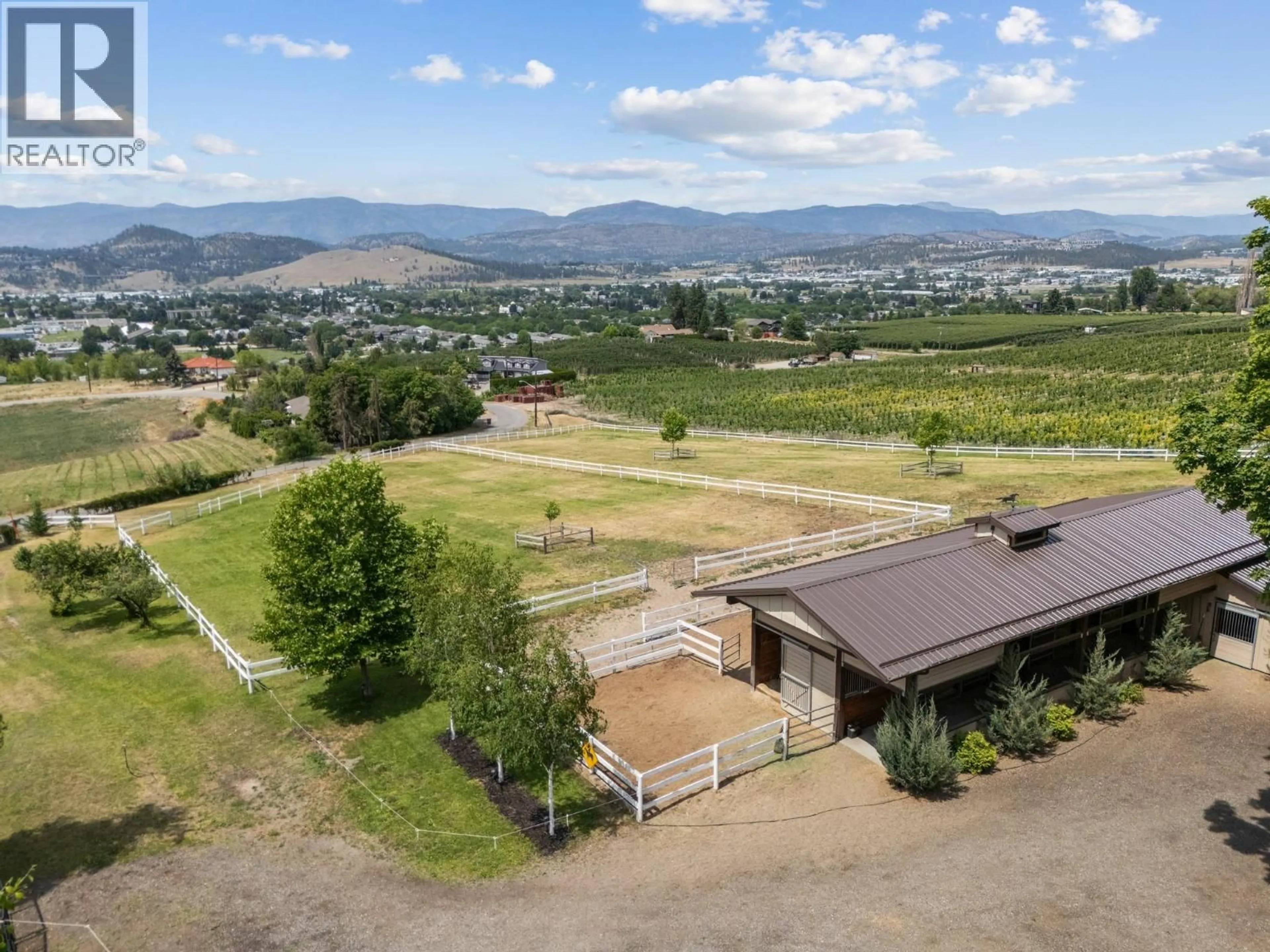 A pic from outside/outdoor area/front of a property/back of a property/a pic from drone, mountain view for 1052 WEBSTER ROAD, Kelowna British Columbia V1P1C2