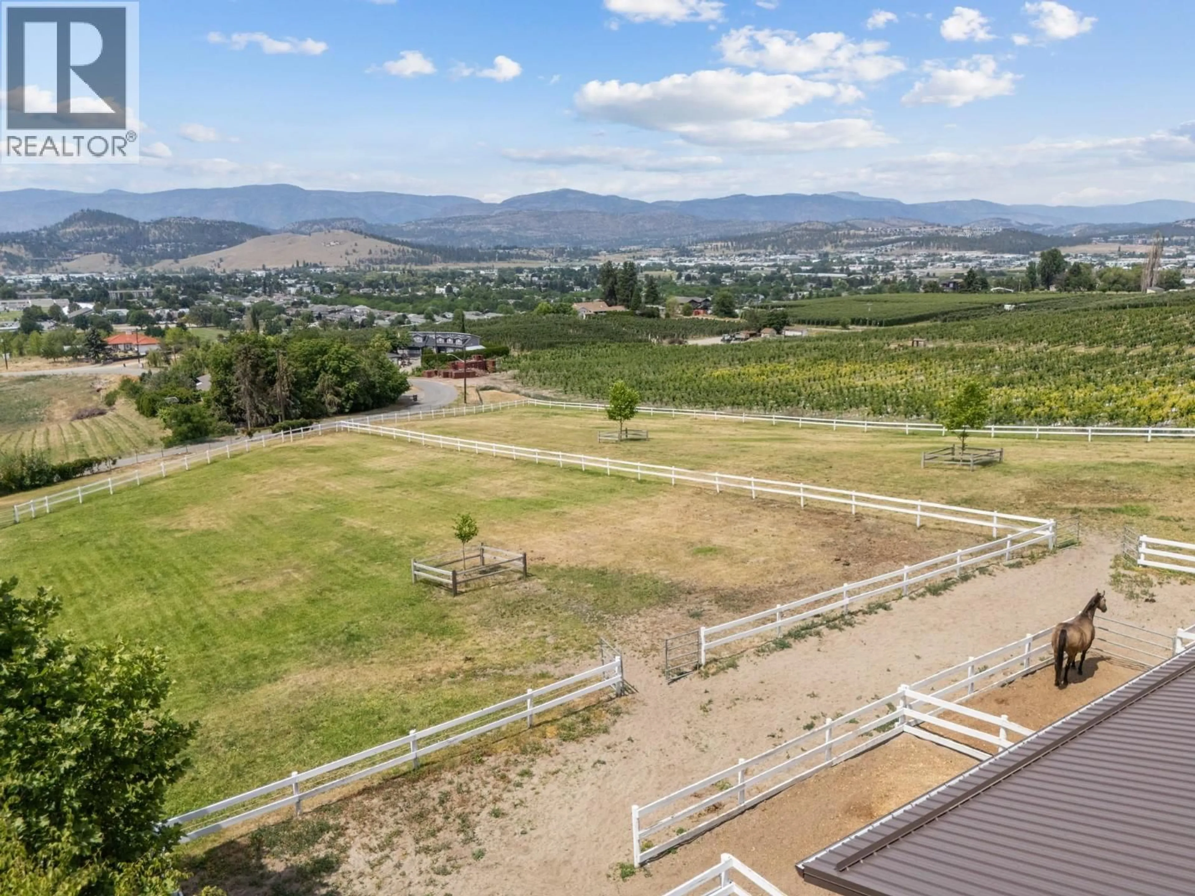 A pic from outside/outdoor area/front of a property/back of a property/a pic from drone, mountain view for 1052 WEBSTER ROAD, Kelowna British Columbia V1P1C2