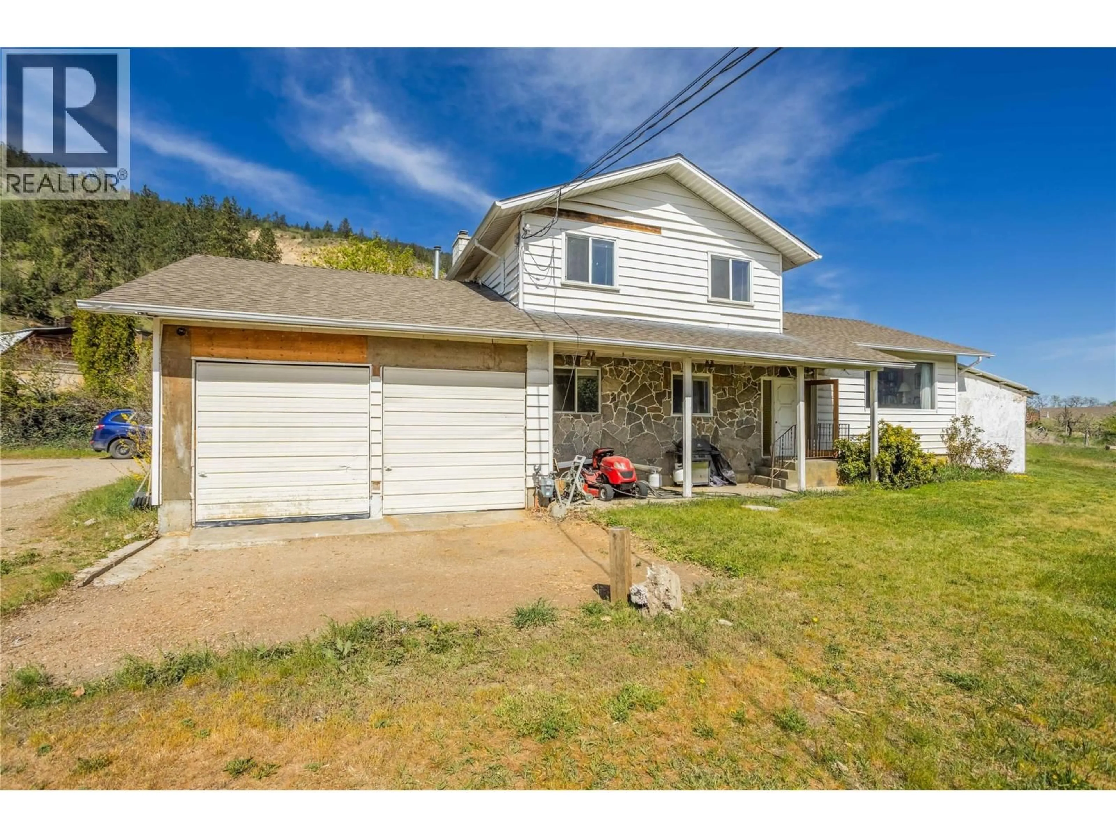 A pic from outside/outdoor area/front of a property/back of a property/a pic from drone, street for 15370 OLD MISSION ROAD, Lake Country British Columbia V4V2G5