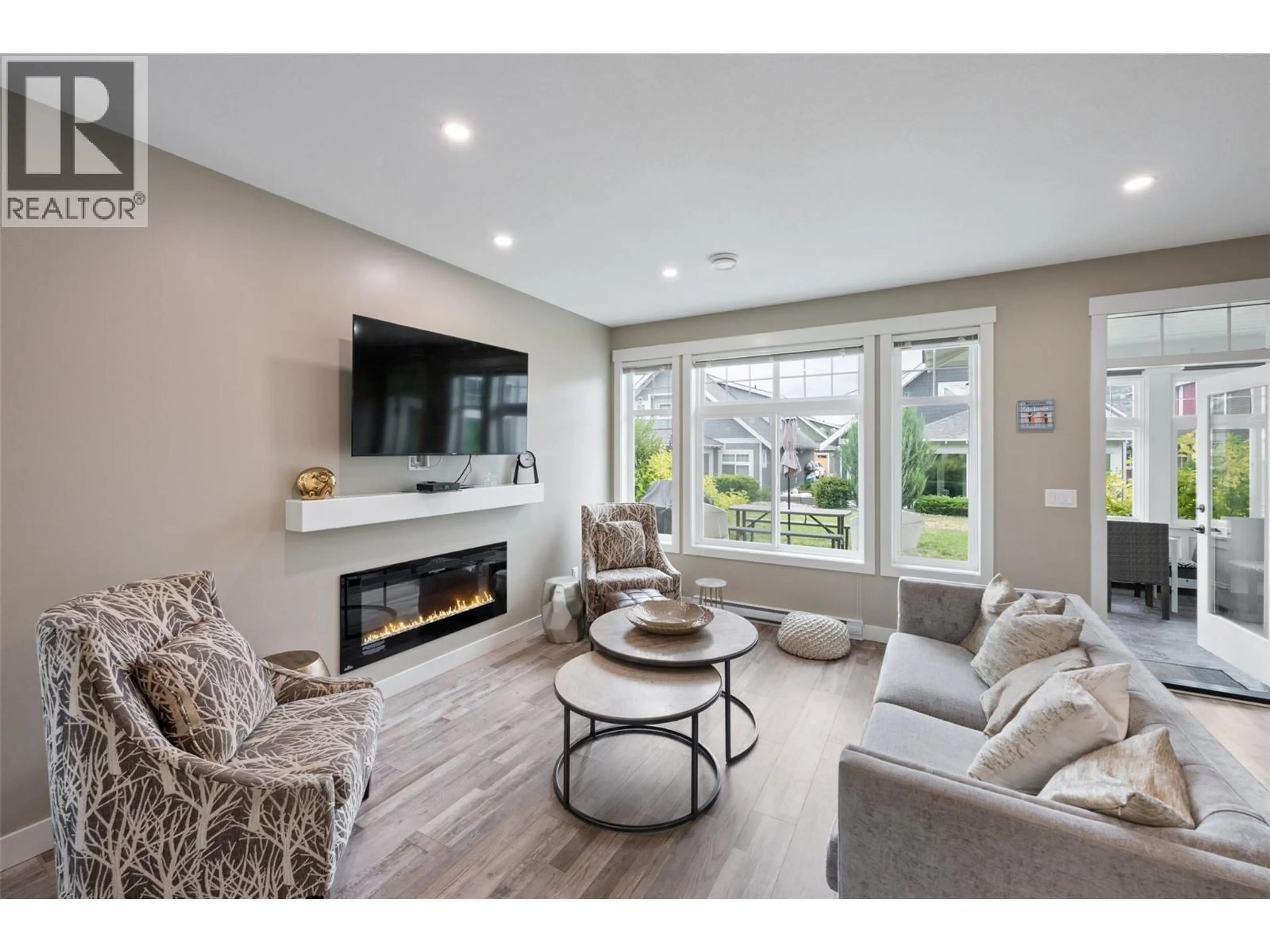 Living room with furniture, wood/laminate floor for 55 - 2450 RADIO TOWER ROAD, Oliver British Columbia V0H1T1
