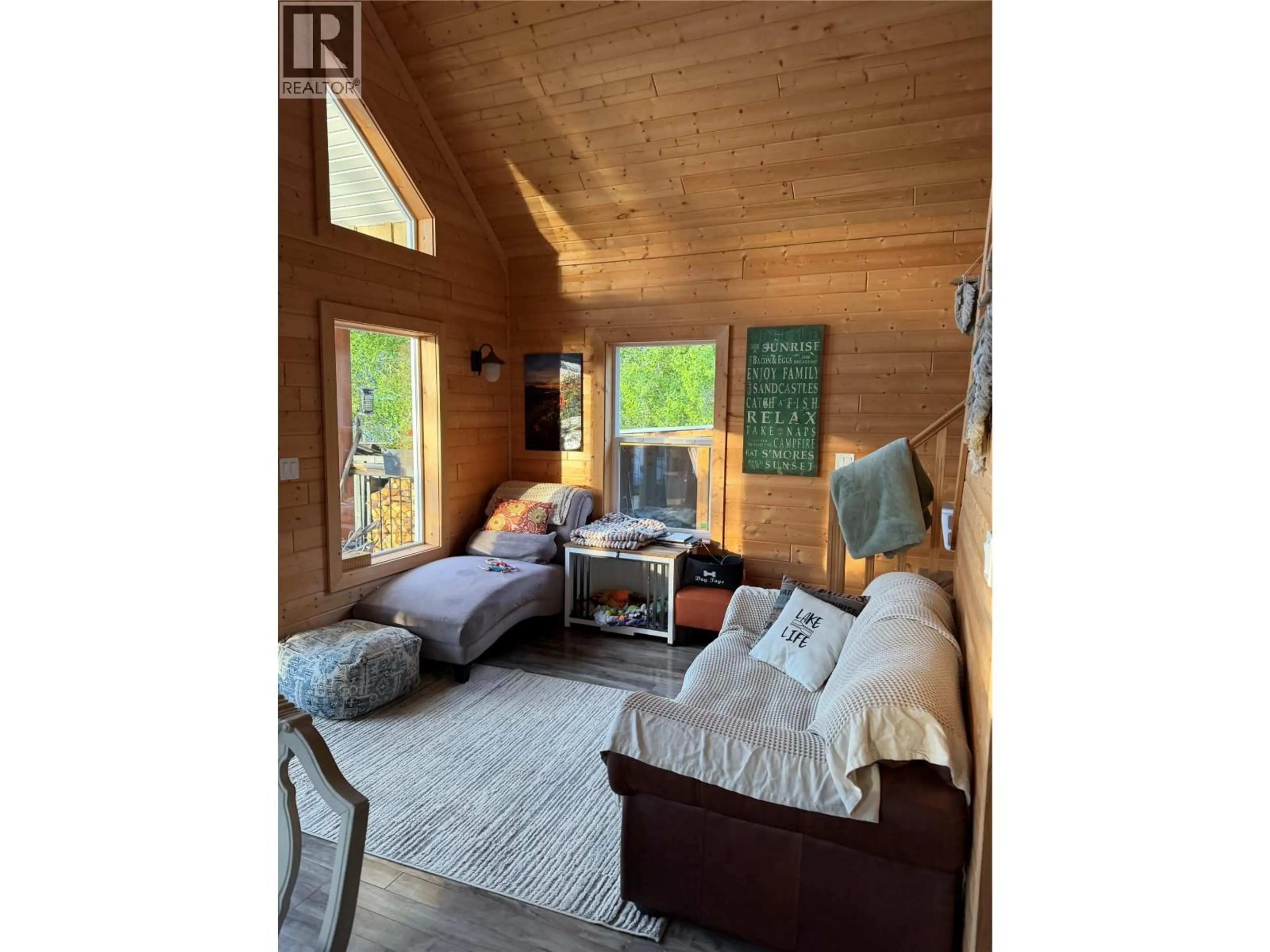 Living room with furniture, wood/laminate floor for 6808 MOBERLY LAKE ROAD SOUTH, Moberly Lake British Columbia V0C1X0
