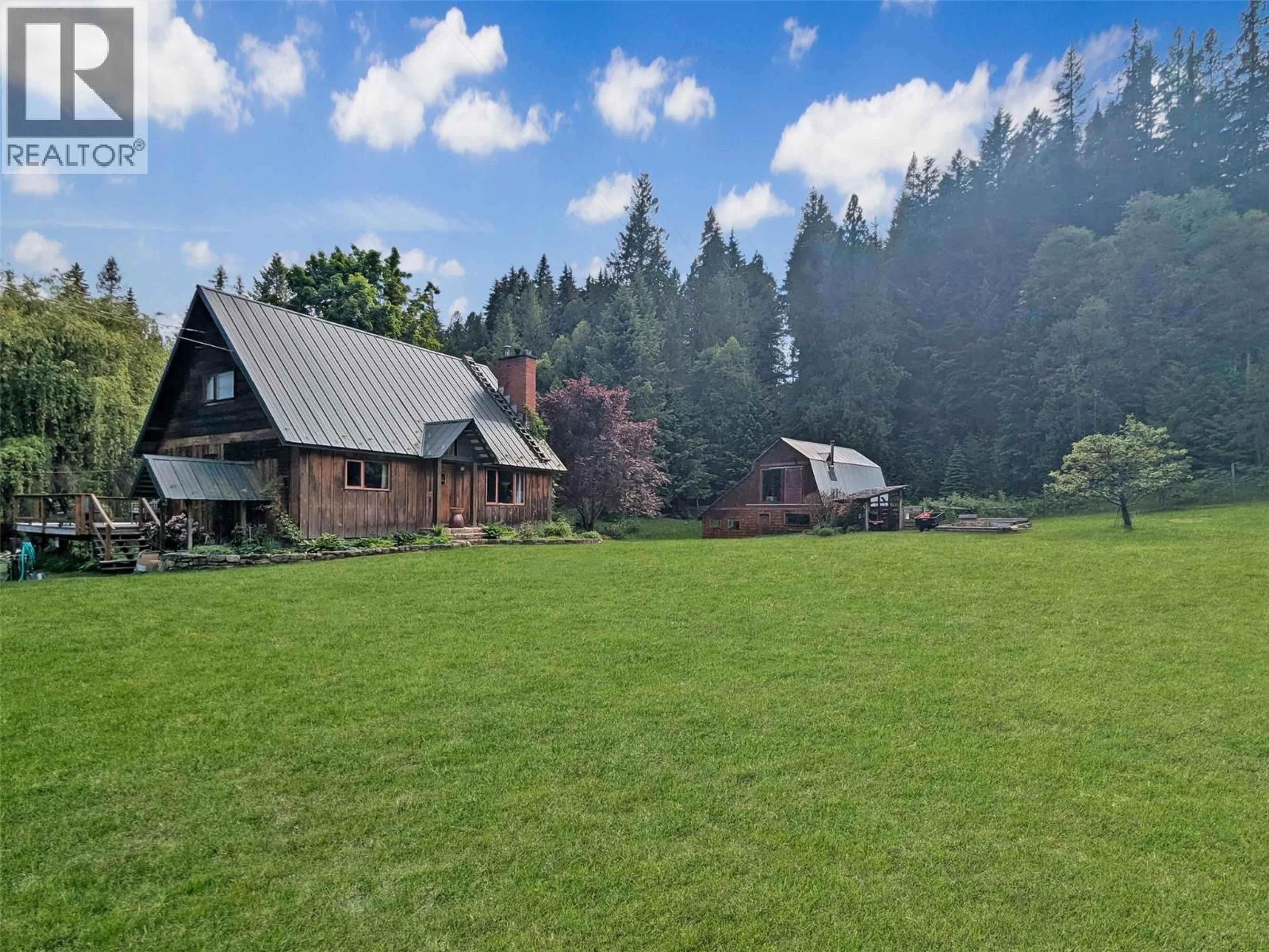 A pic from outside/outdoor area/front of a property/back of a property/a pic from drone, mountain view for 7421 AVIS ROAD, Winlaw British Columbia V0G2J0