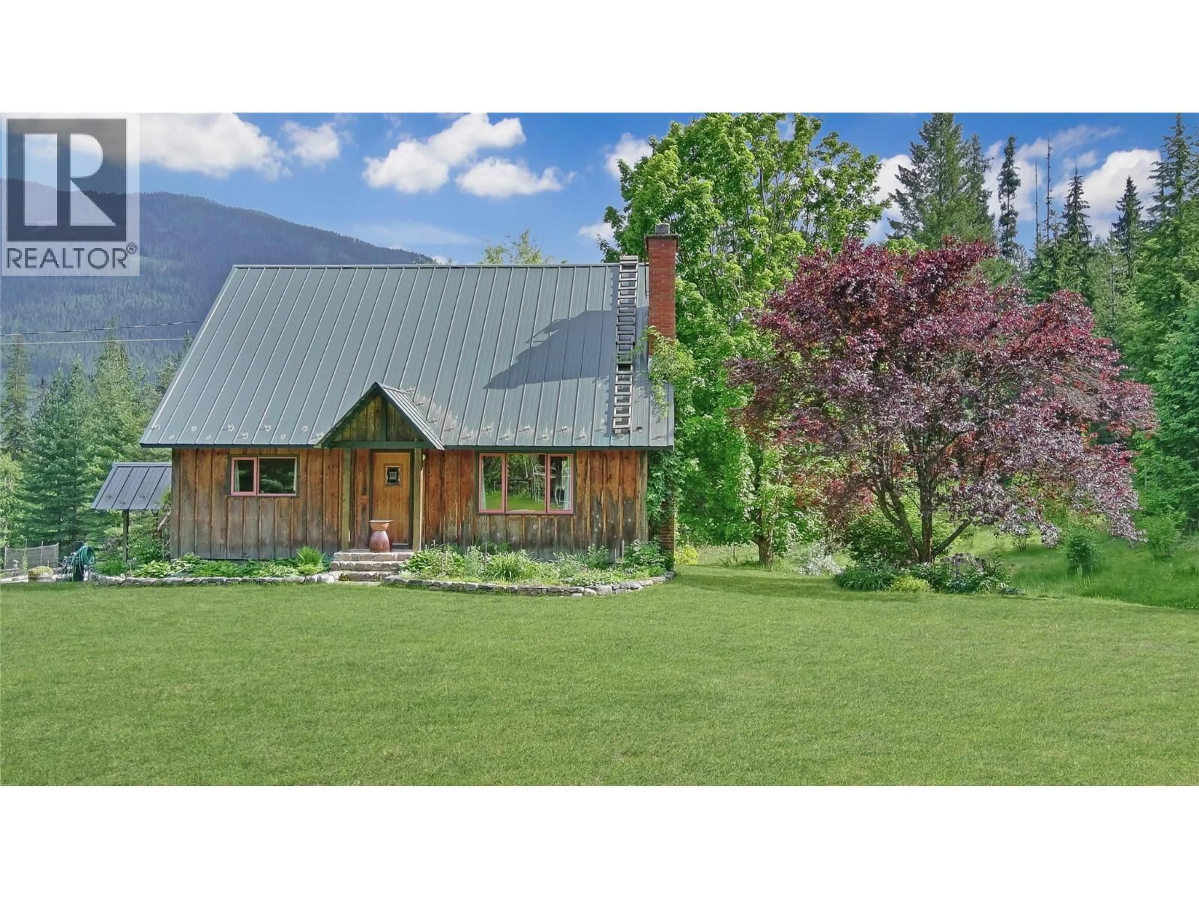 A pic from outside/outdoor area/front of a property/back of a property/a pic from drone, mountain view for 7421 AVIS ROAD, Winlaw British Columbia V0G2J0