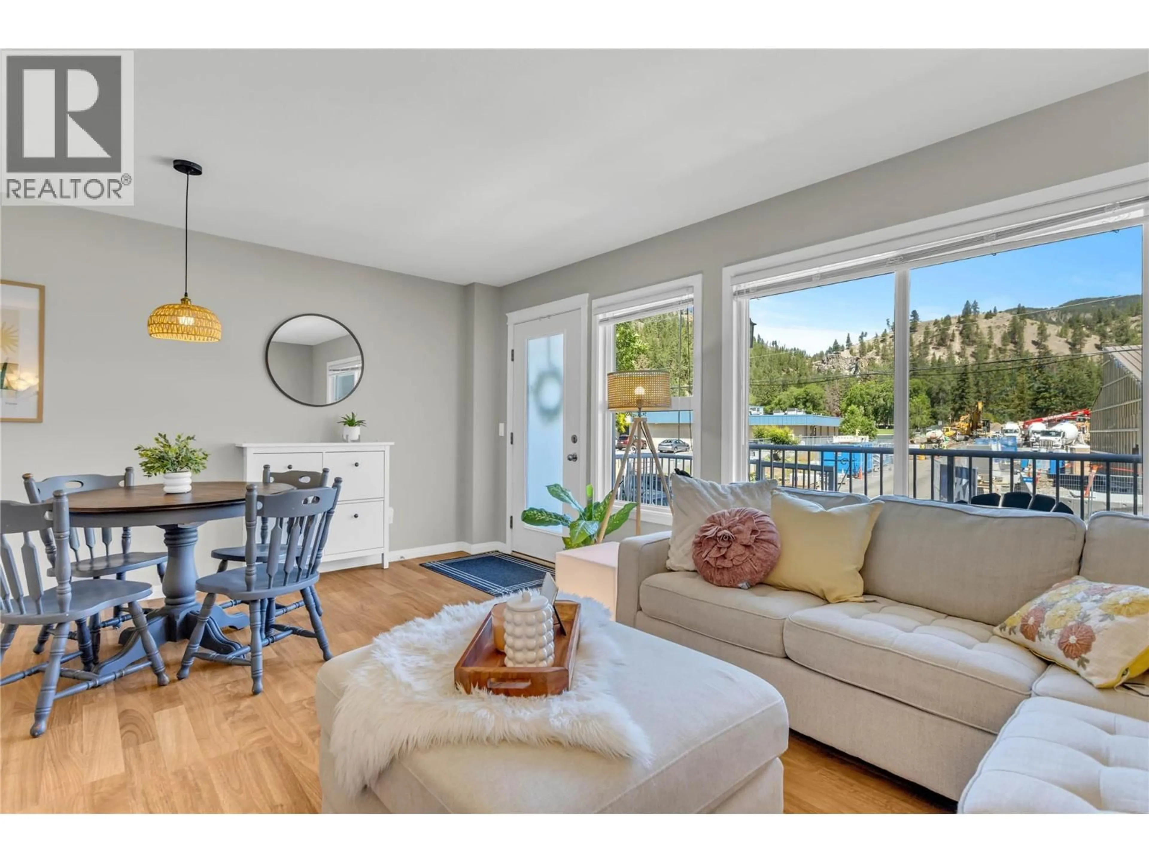 Living room with furniture, wood/laminate floor for 103 - 5460 CLEMENTS CRESCENT, Peachland British Columbia V0H1X5
