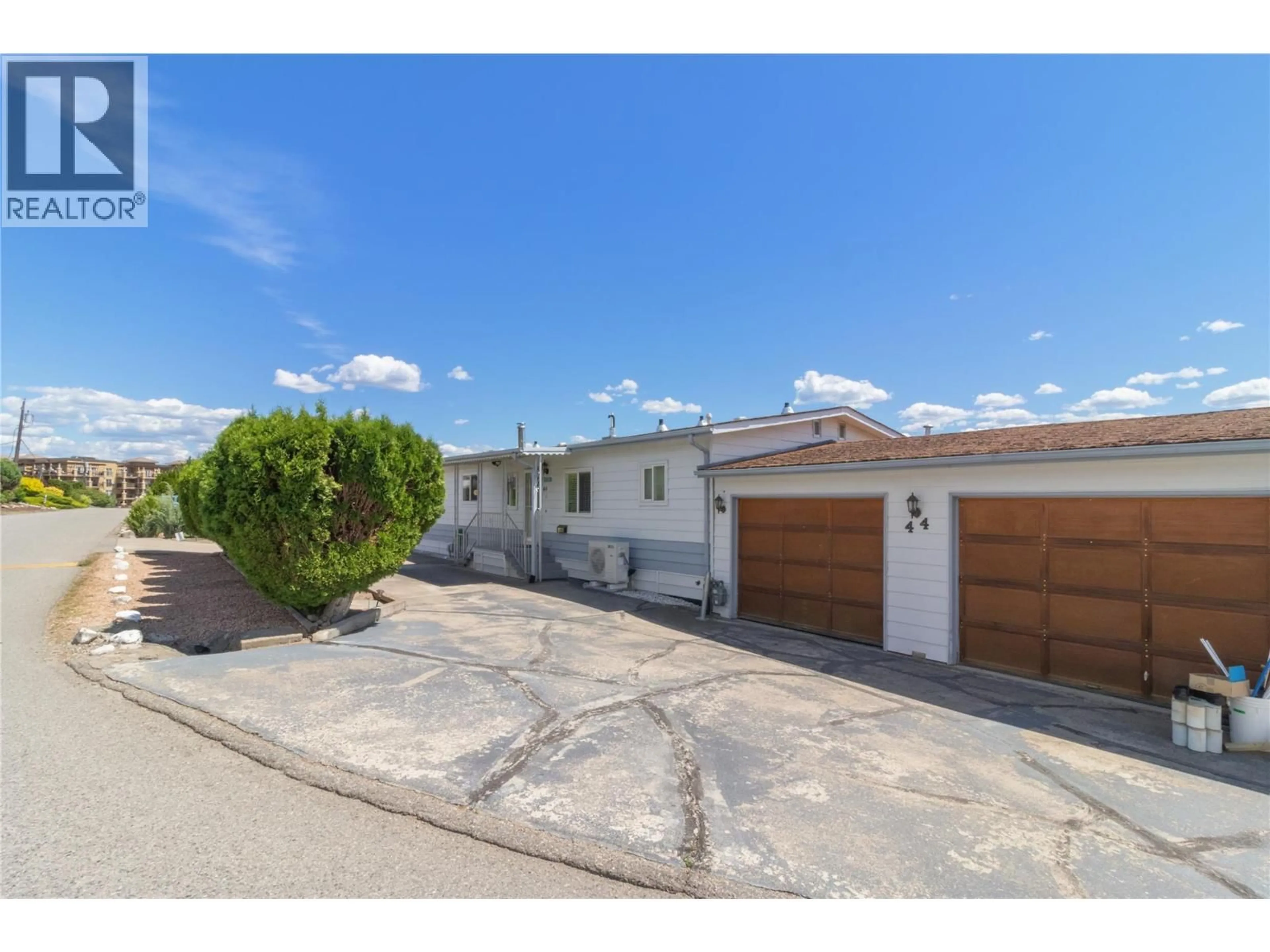 A pic from outside/outdoor area/front of a property/back of a property/a pic from drone, street for 44 - 2098 BOUCHERIE ROAD, West Kelowna British Columbia V4T2A5