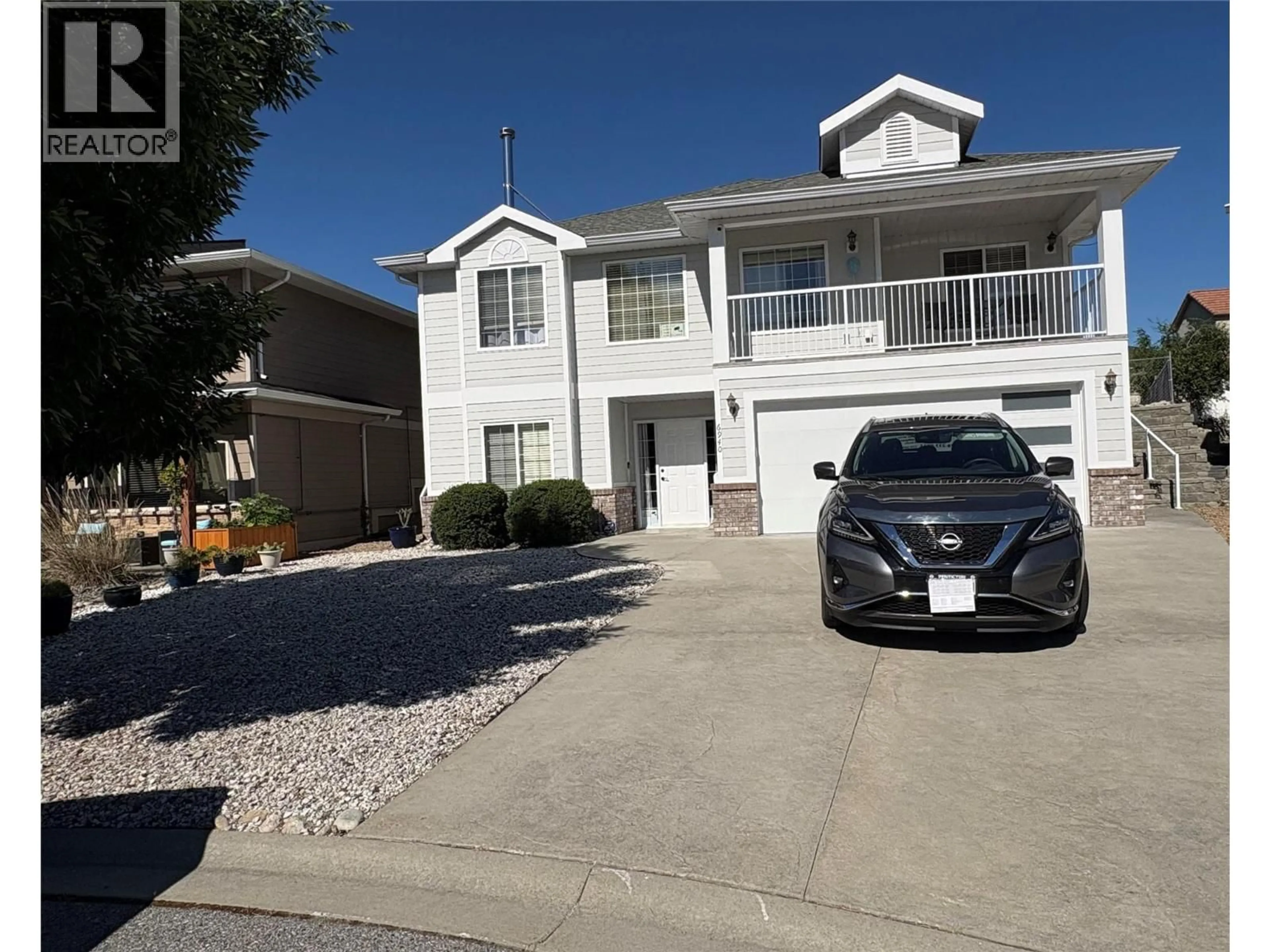 Home with vinyl exterior material, street for 6940 CABERNET PLACE, Oliver British Columbia V0H1T4