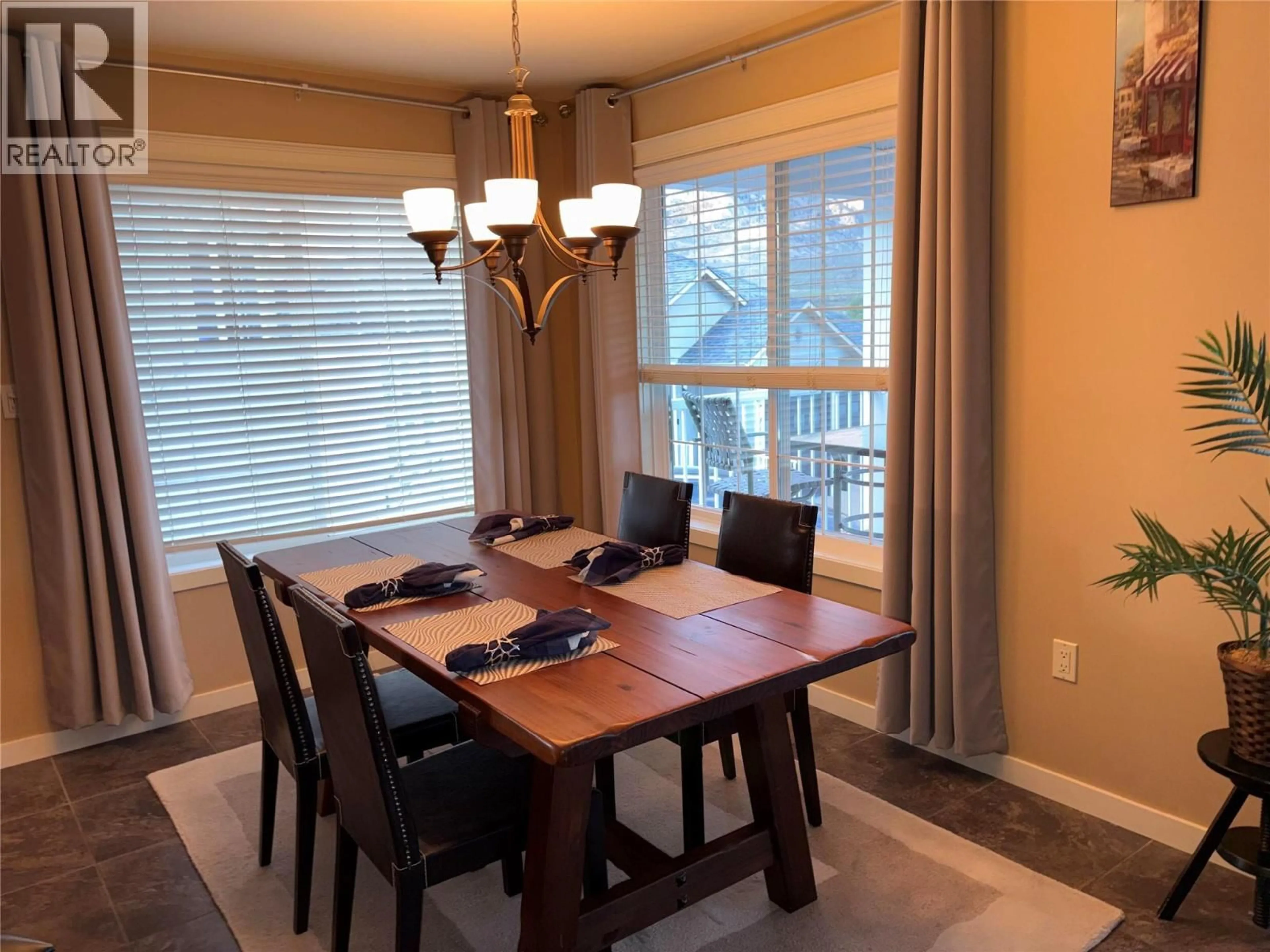 Dining room, wood/laminate floor for 6940 CABERNET PLACE, Oliver British Columbia V0H1T4