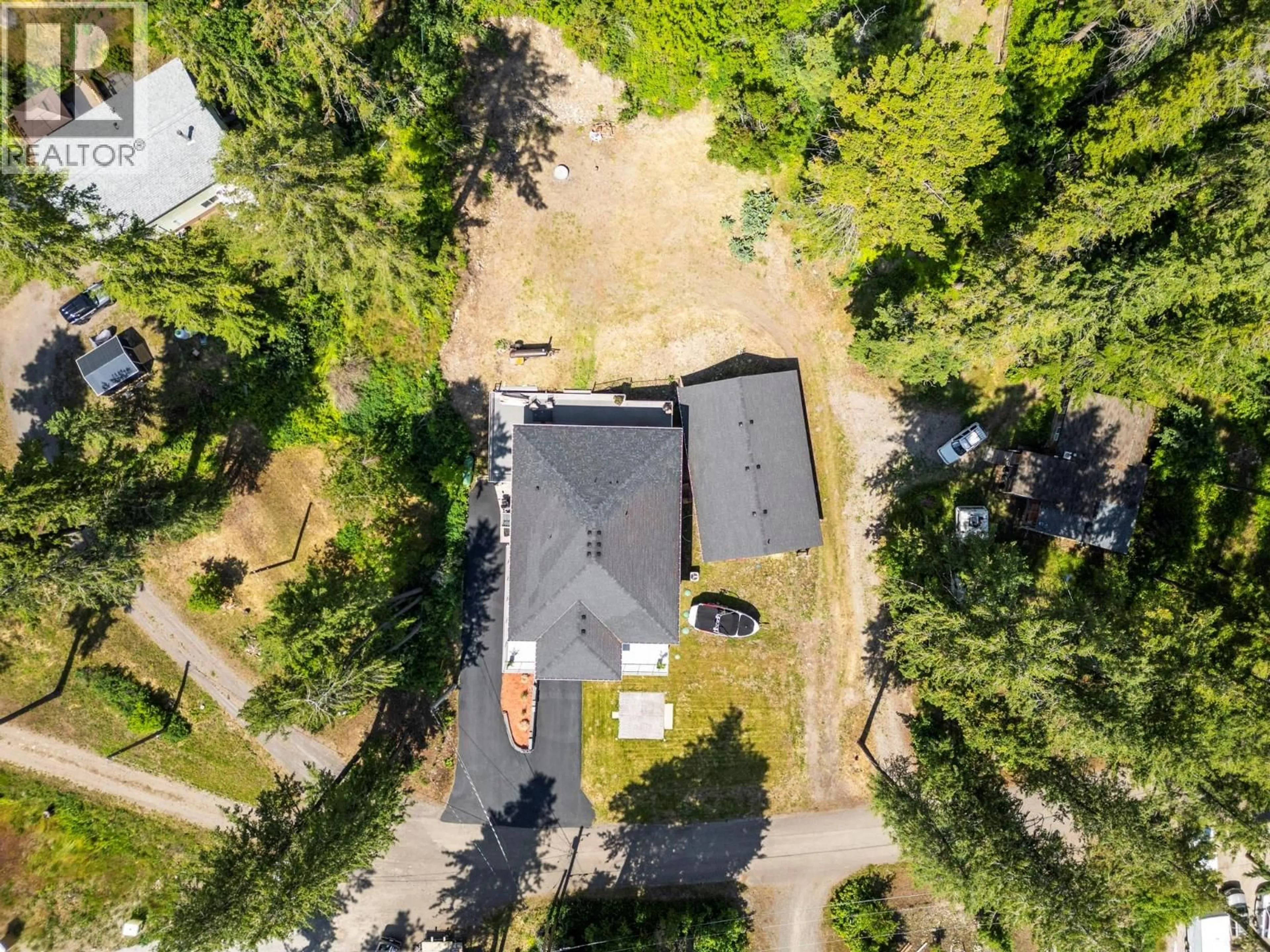A pic from outside/outdoor area/front of a property/back of a property/a pic from drone, forest/trees view for 70 LESTER ROAD, Vernon British Columbia V1H2G3