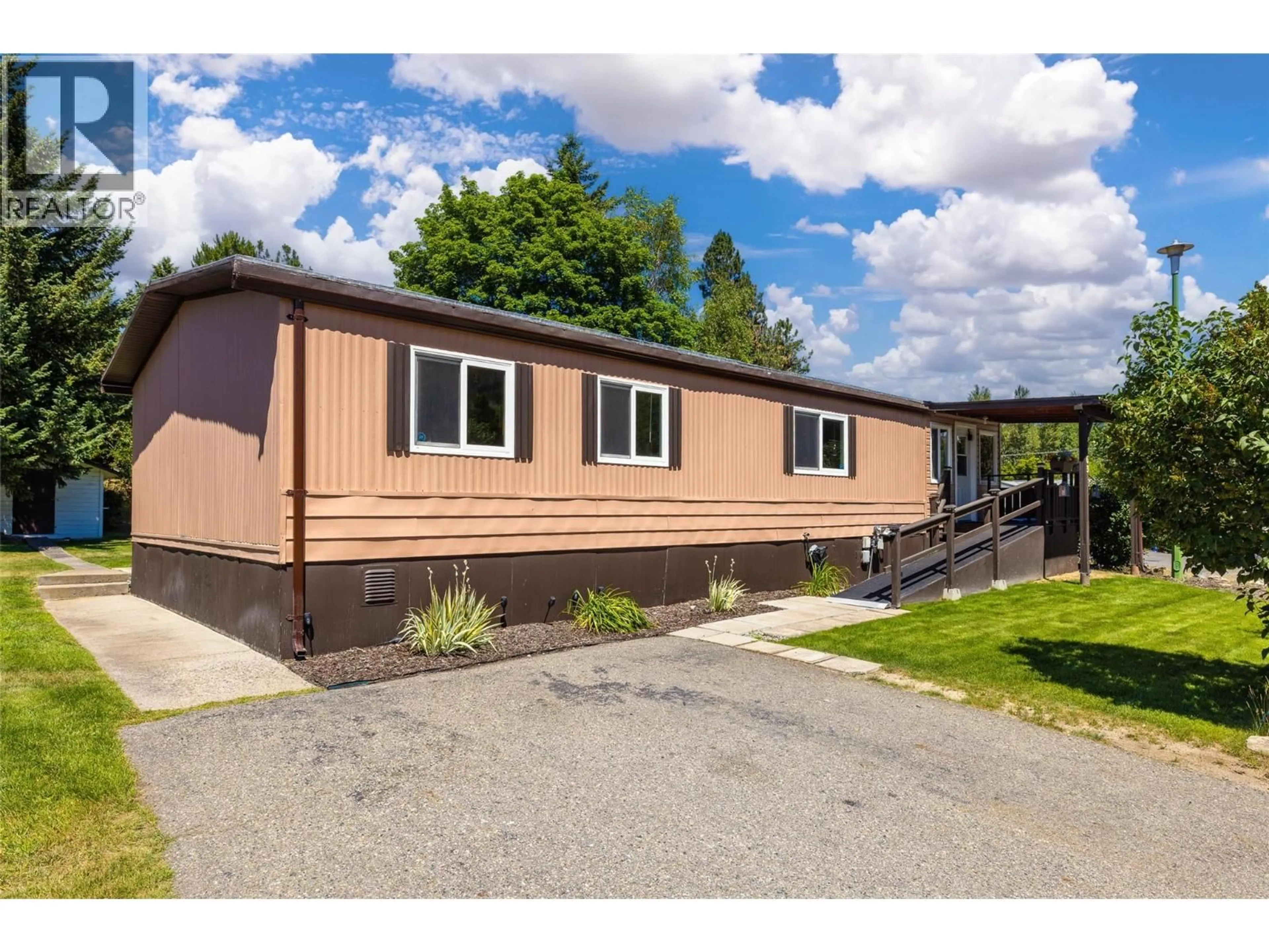 Home with vinyl exterior material, street for 63 - 1929 HIGHWAY 97S HIGHWAY, Westbank British Columbia V1Z2Z1