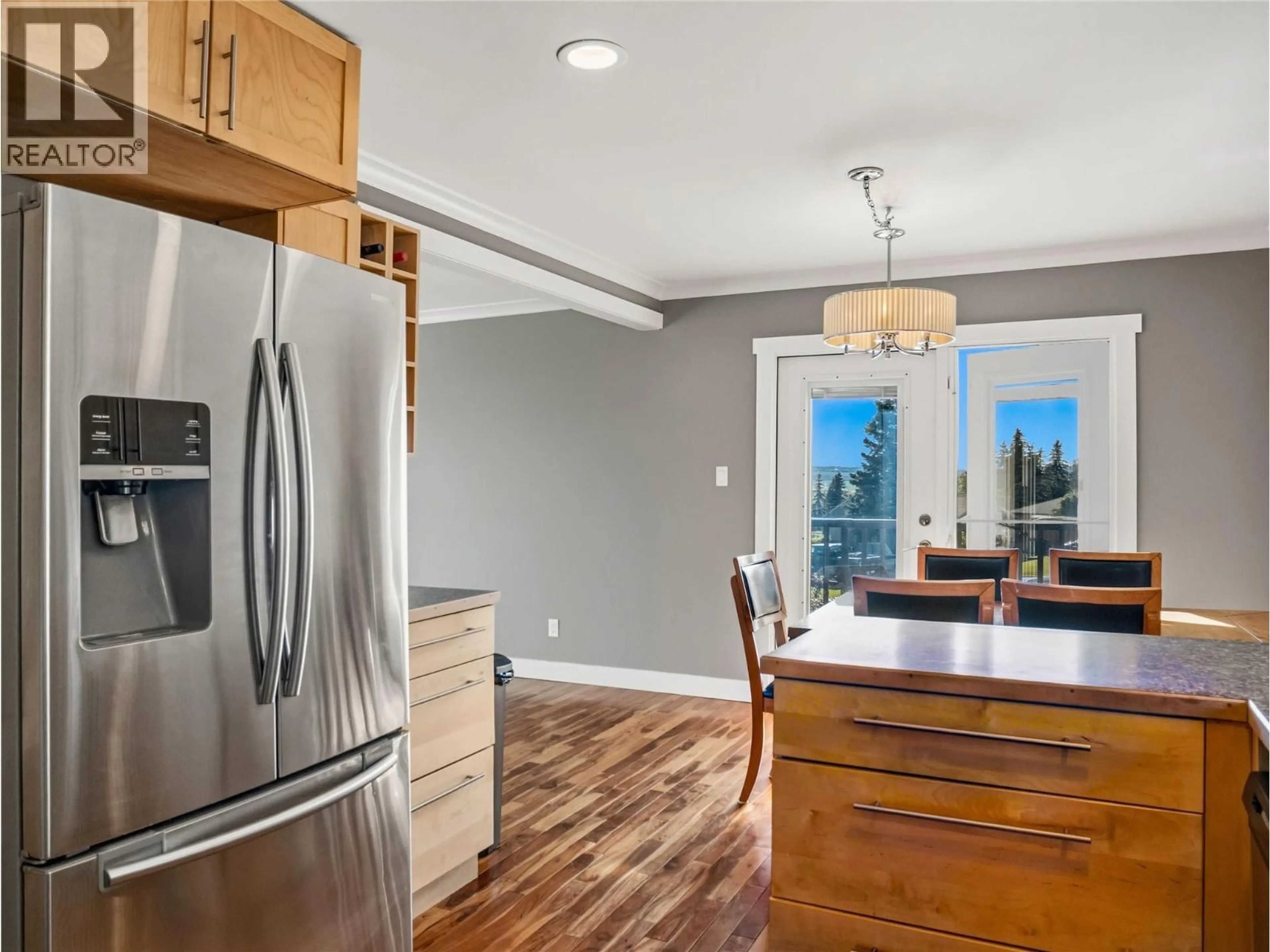 Open concept kitchen, wood/laminate floor for 1700 92 AVENUE, Dawson Creek British Columbia V1G1C5
