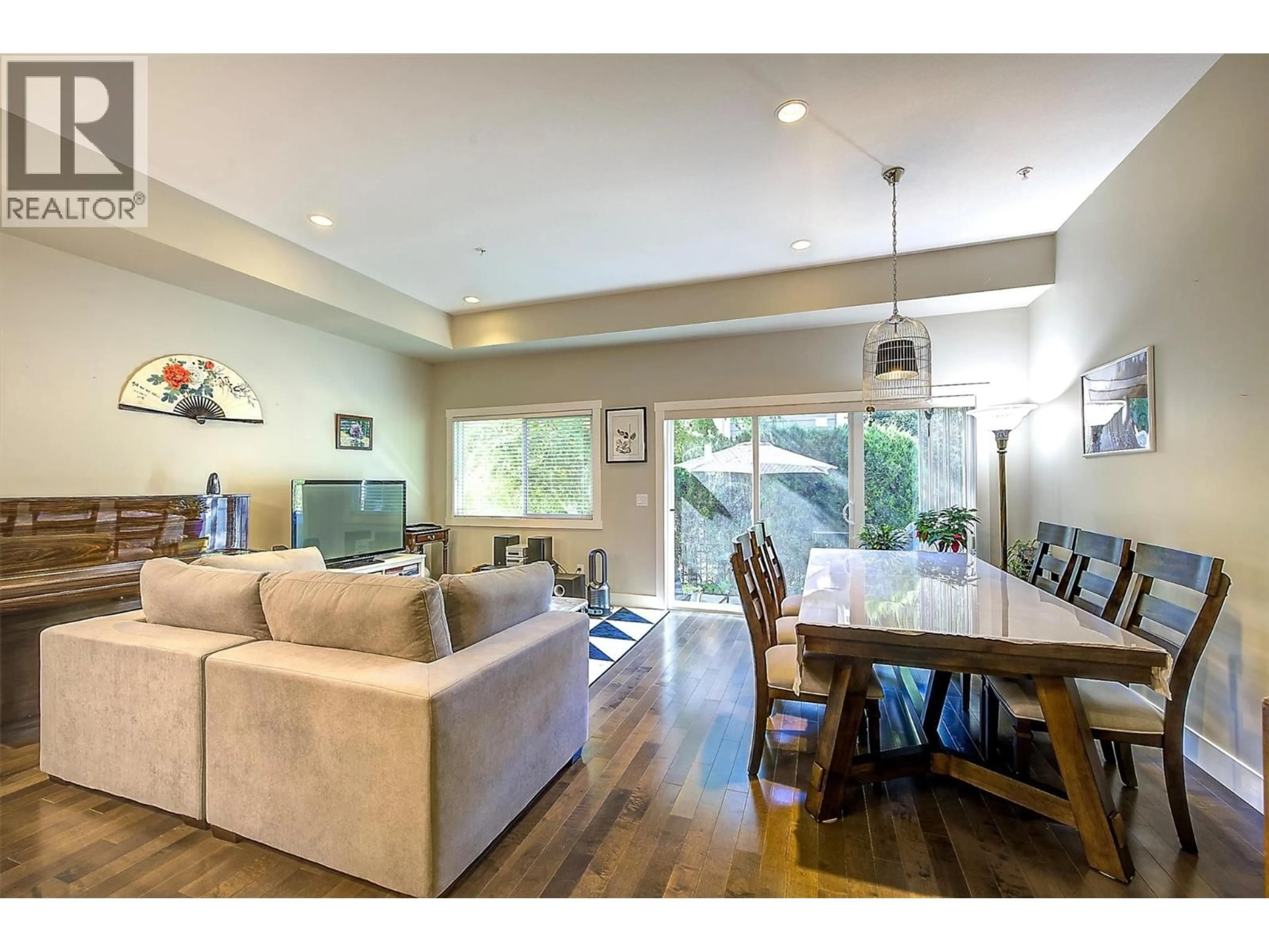 Living room with furniture, wood/laminate floor for 54 - 600 BOYNTON PLACE, Kelowna British Columbia V1V3B8