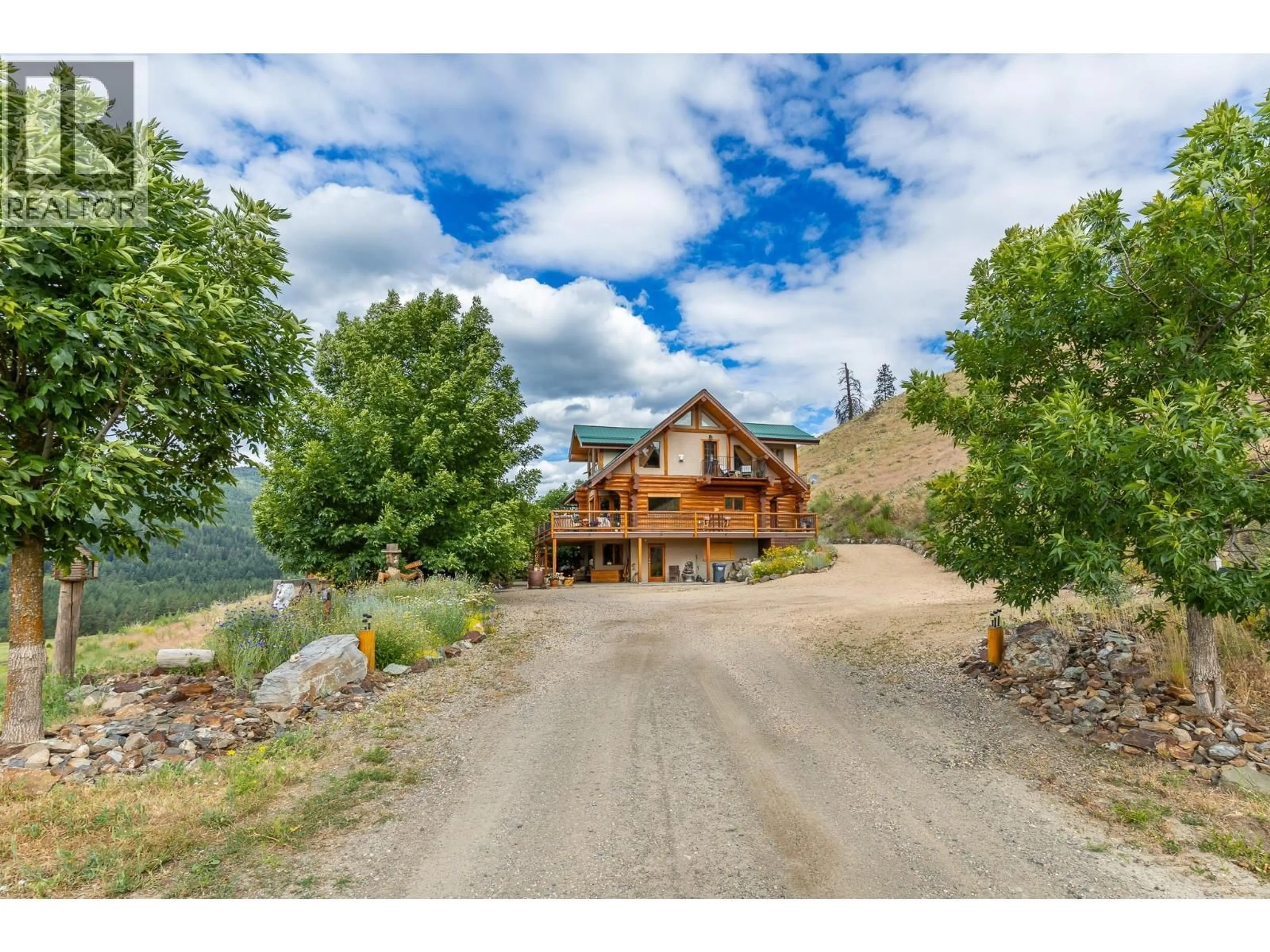 A pic from outside/outdoor area/front of a property/back of a property/a pic from drone, mountain view for 1225 ROUND LAKE ROAD, Armstrong British Columbia V0E1B5