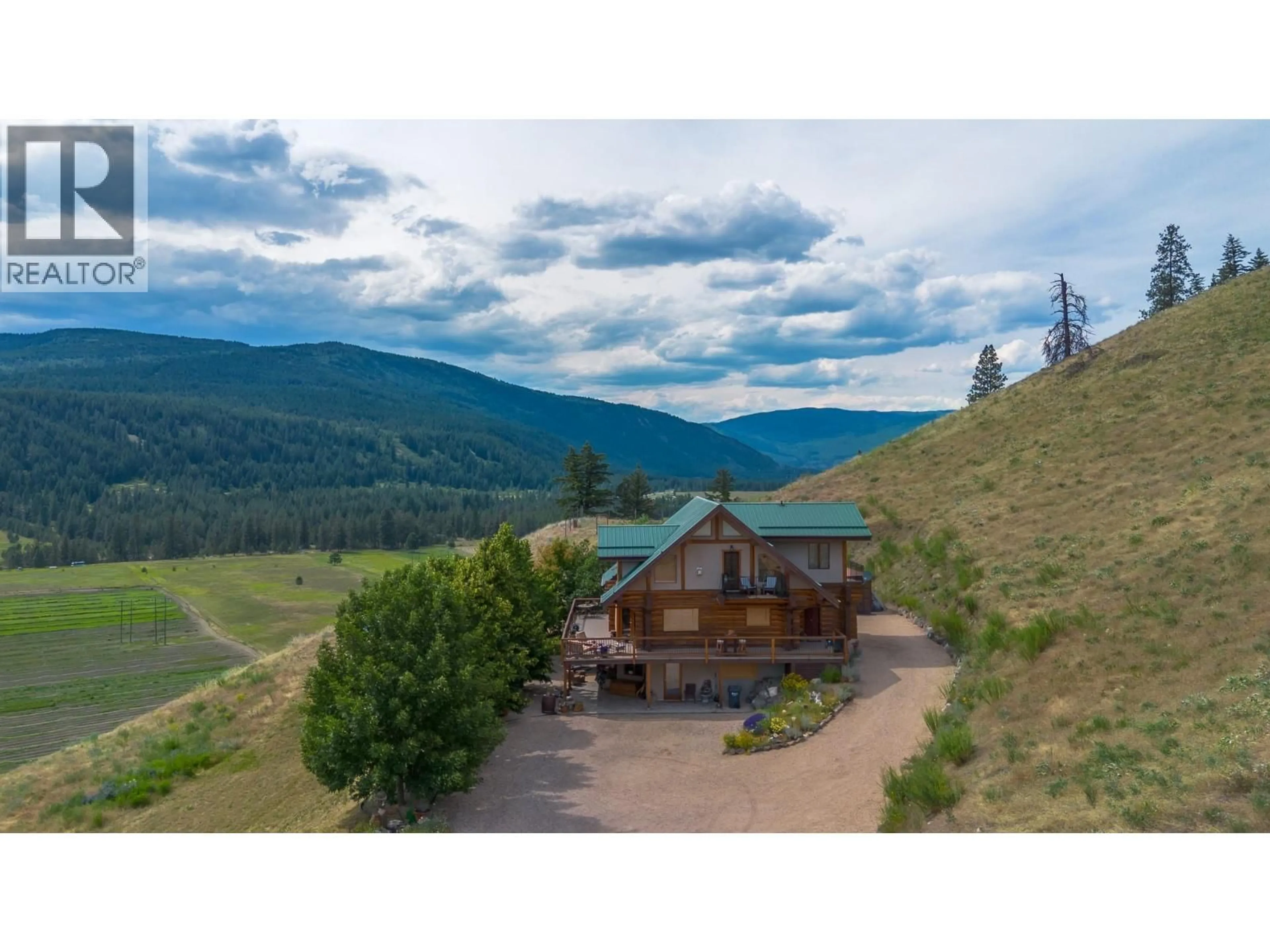 A pic from outside/outdoor area/front of a property/back of a property/a pic from drone, mountain view for 1225 ROUND LAKE ROAD, Armstrong British Columbia V0E1B5