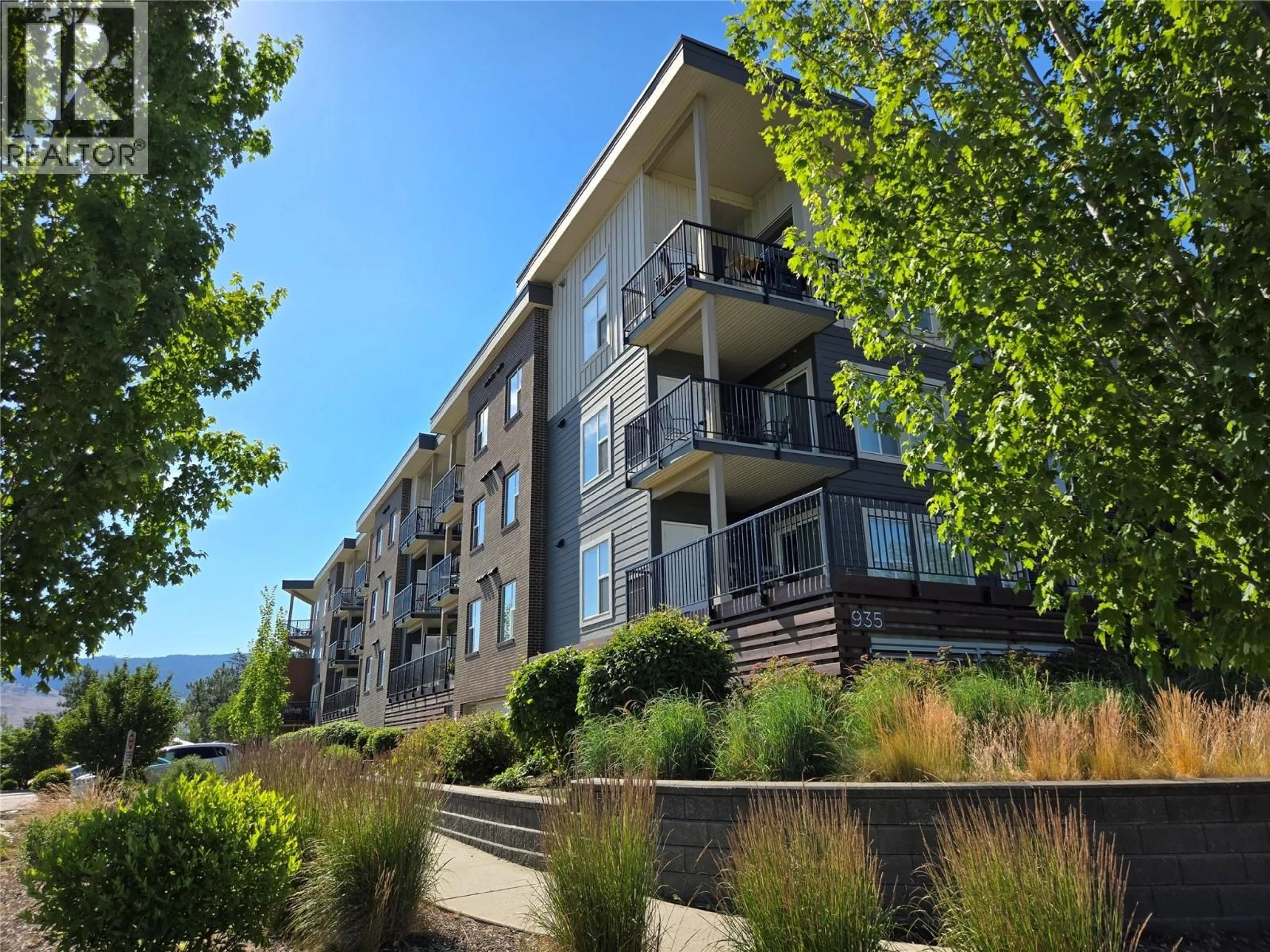 A pic from outside/outdoor area/front of a property/back of a property/a pic from drone, unknown for 202 - 935 ACADEMY WAY, Kelowna British Columbia V1V3C9