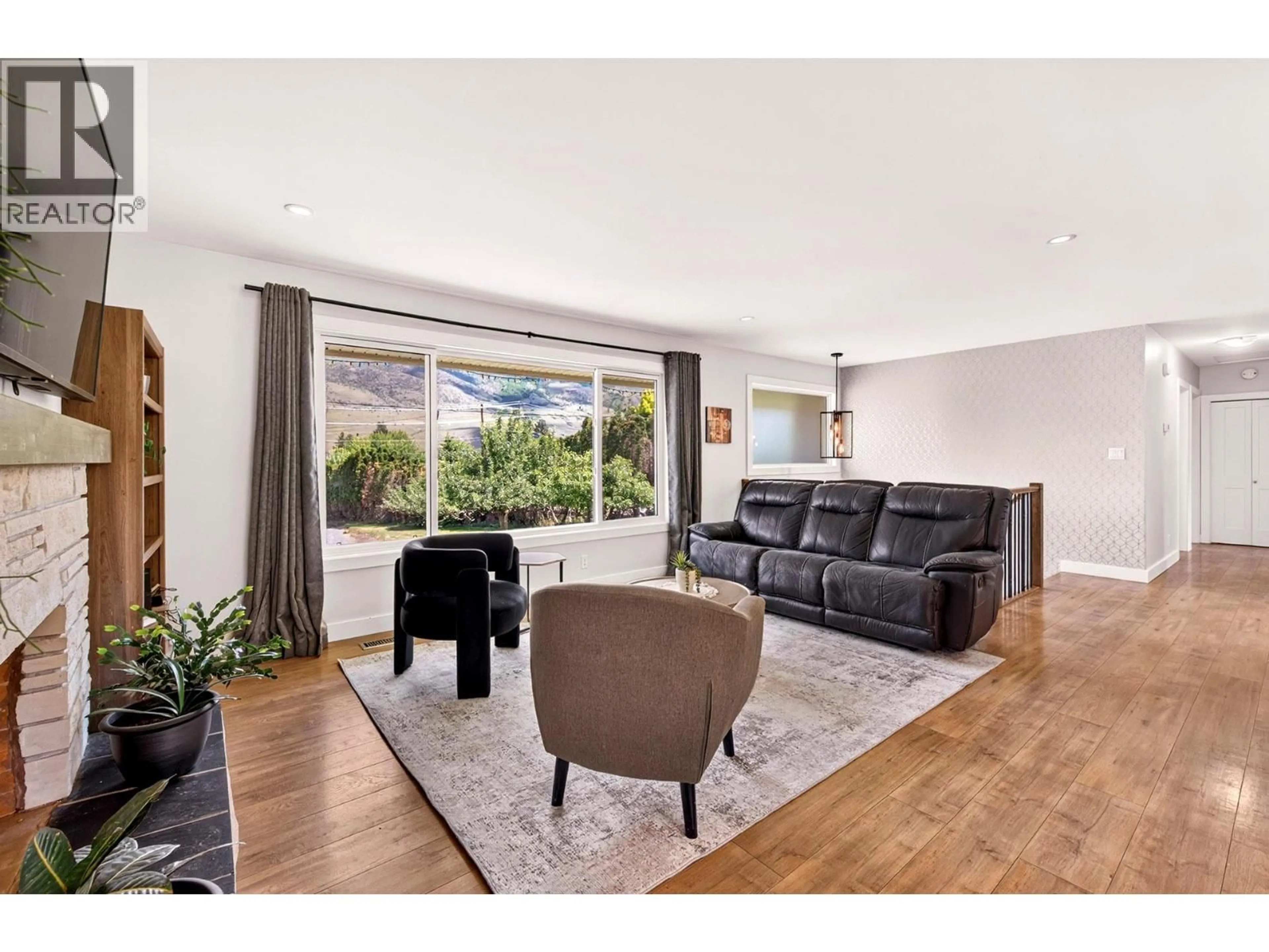 Living room with furniture, wood/laminate floor for 3644 WESTSYDE ROAD, Kamloops British Columbia V2B7H6
