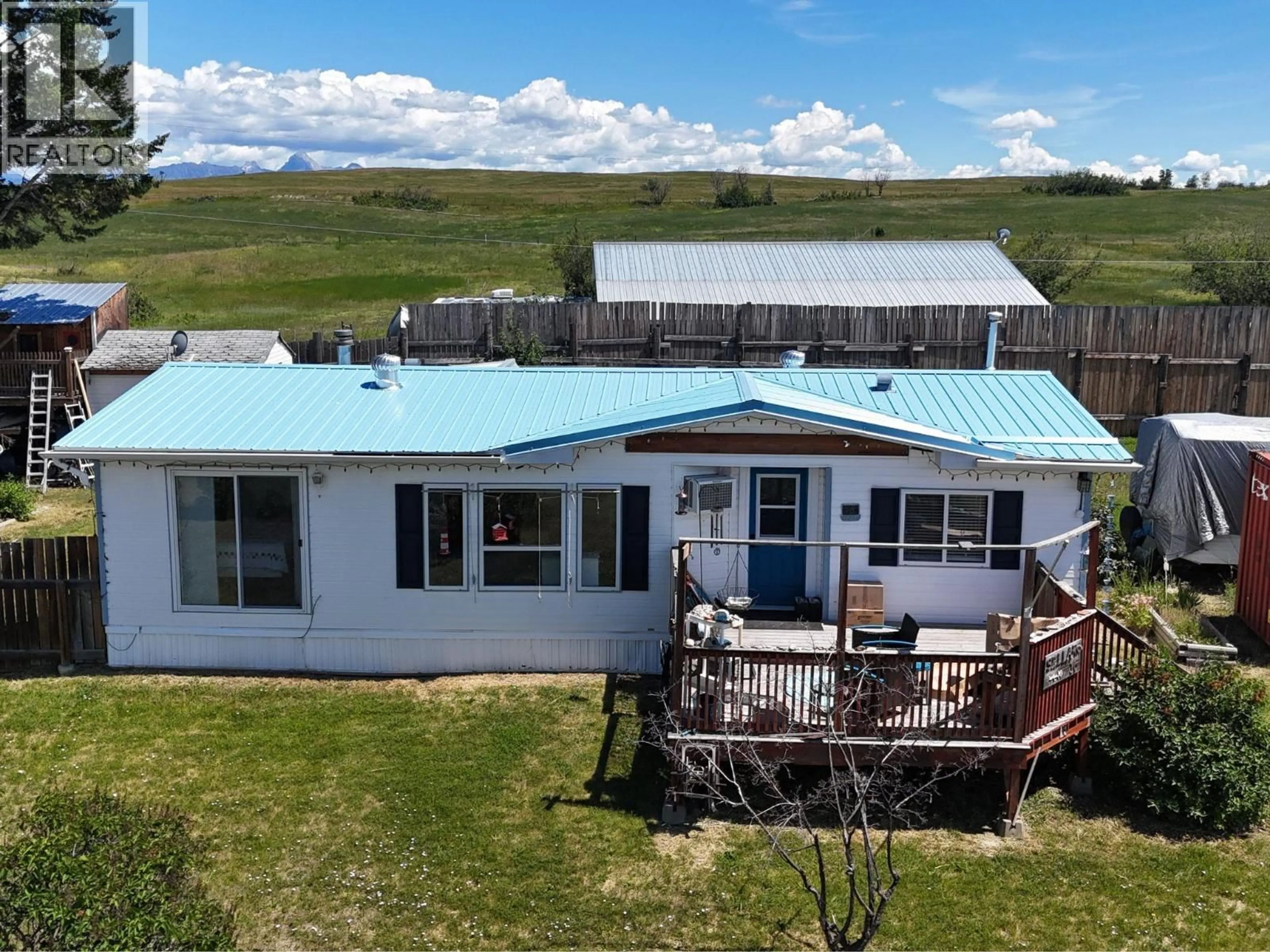 A pic from outside/outdoor area/front of a property/back of a property/a pic from drone, building for 16 - 9762 ERMACORA ROAD, Cranbrook British Columbia V1C7E1