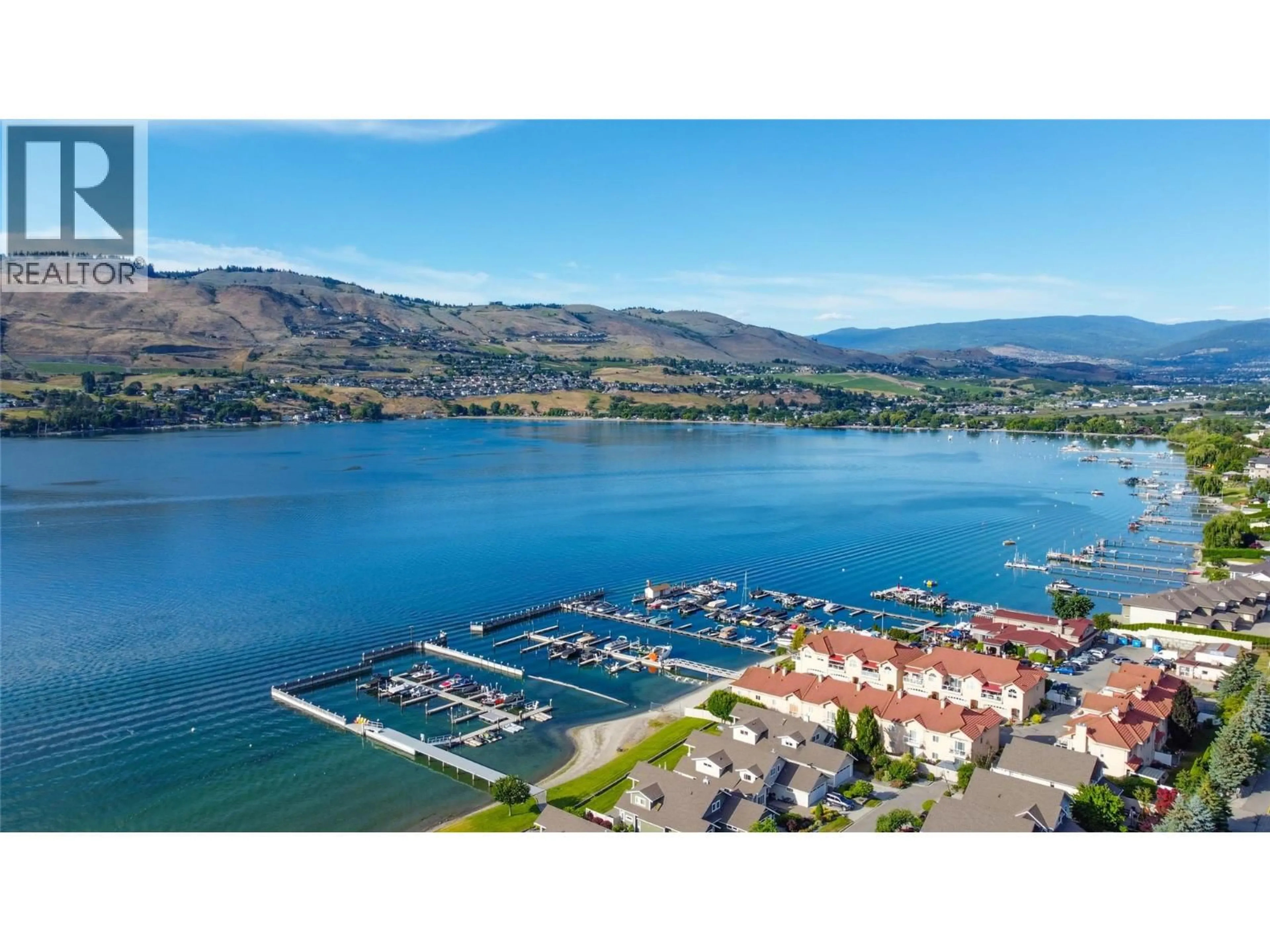A pic from outside/outdoor area/front of a property/back of a property/a pic from drone, water/lake/river/ocean view for 3 - 7701 OKANAGAN LANDING ROAD, Vernon British Columbia V1H1H2