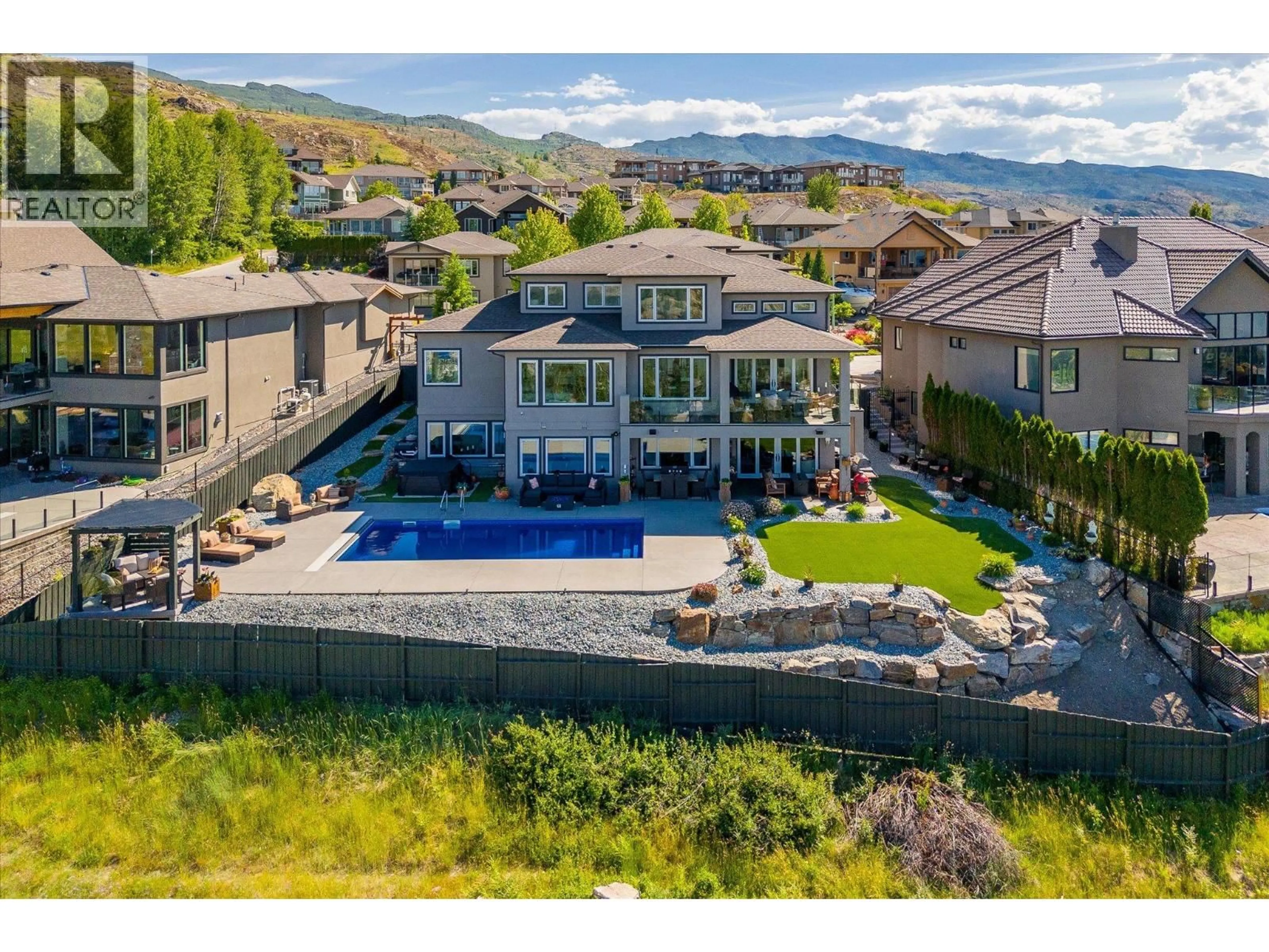 A pic from outside/outdoor area/front of a property/back of a property/a pic from drone, unknown for 750 KUIPERS CRESCENT, Kelowna British Columbia V1W5H4