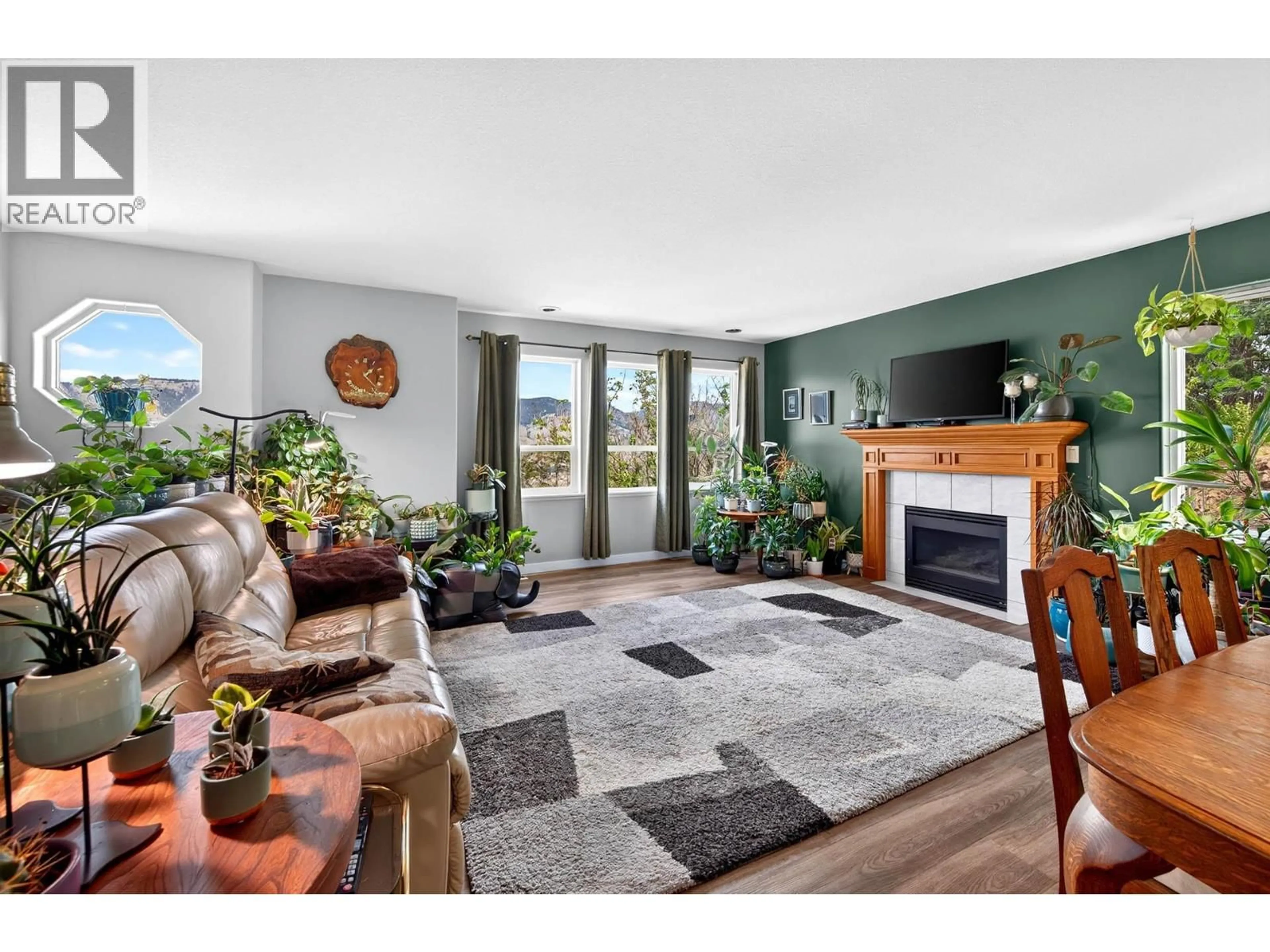 Living room with furniture, wood/laminate floor for 2781 SKEENA DRIVE, Kamloops British Columbia V2E2M9