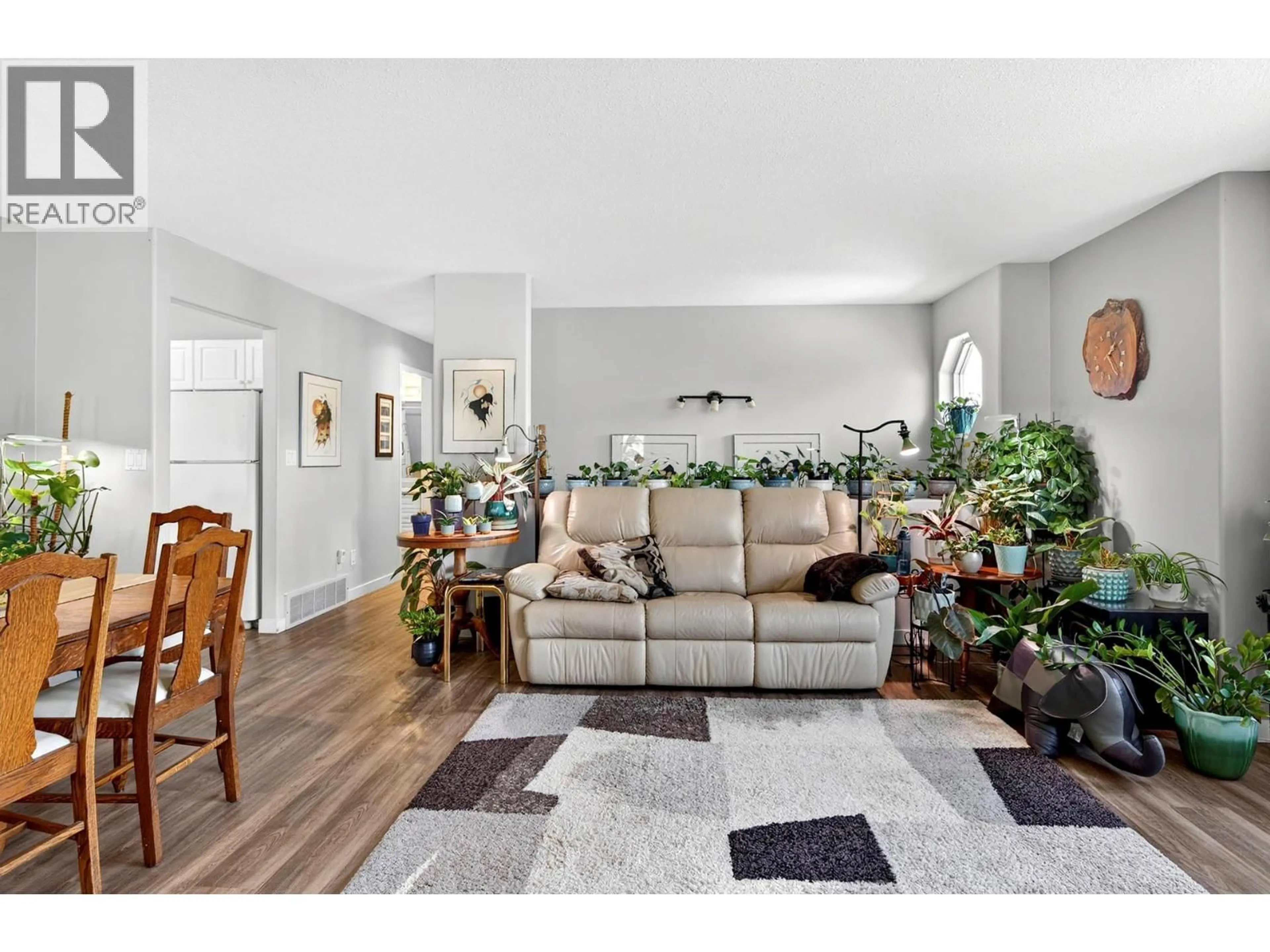 Living room with furniture, wood/laminate floor for 2781 SKEENA DRIVE, Kamloops British Columbia V2E2M9