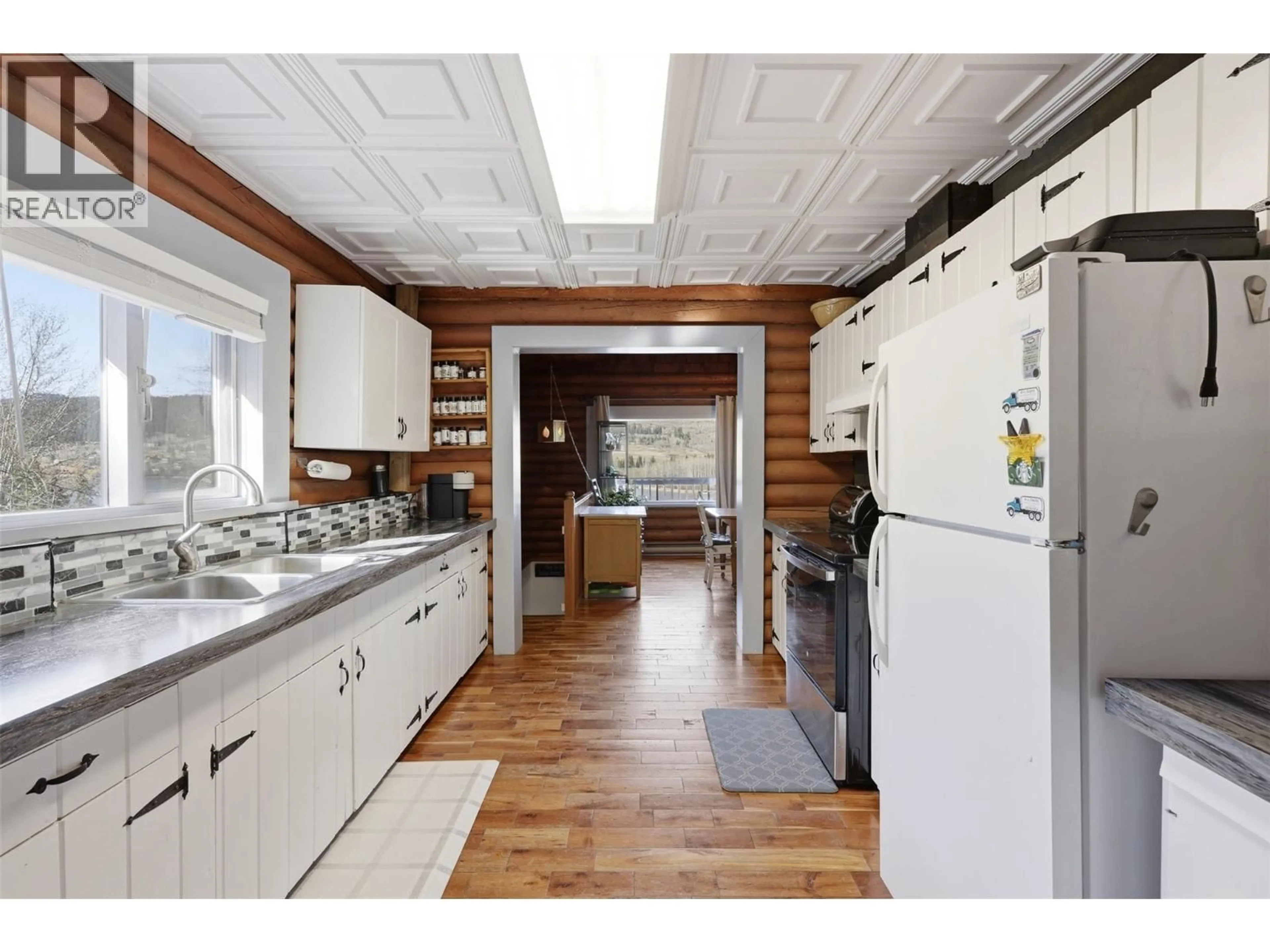 Open concept kitchen, wood/laminate floor for 3267 POWELL ROAD, Kamloops British Columbia V0E3E1