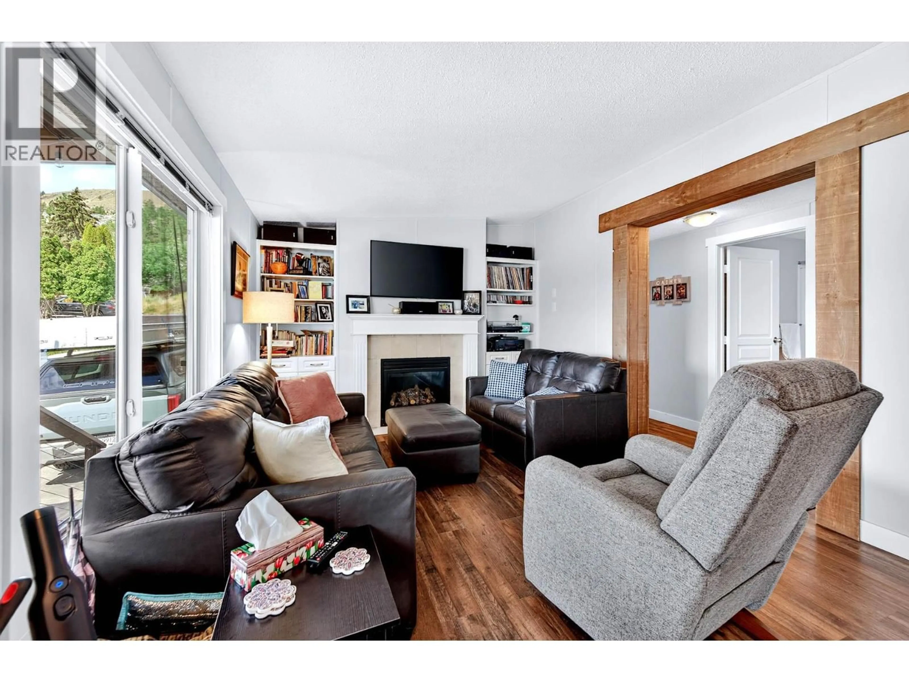Living room with furniture, wood/laminate floor for 940 IDA LANE, Kamloops British Columbia V2B6V1