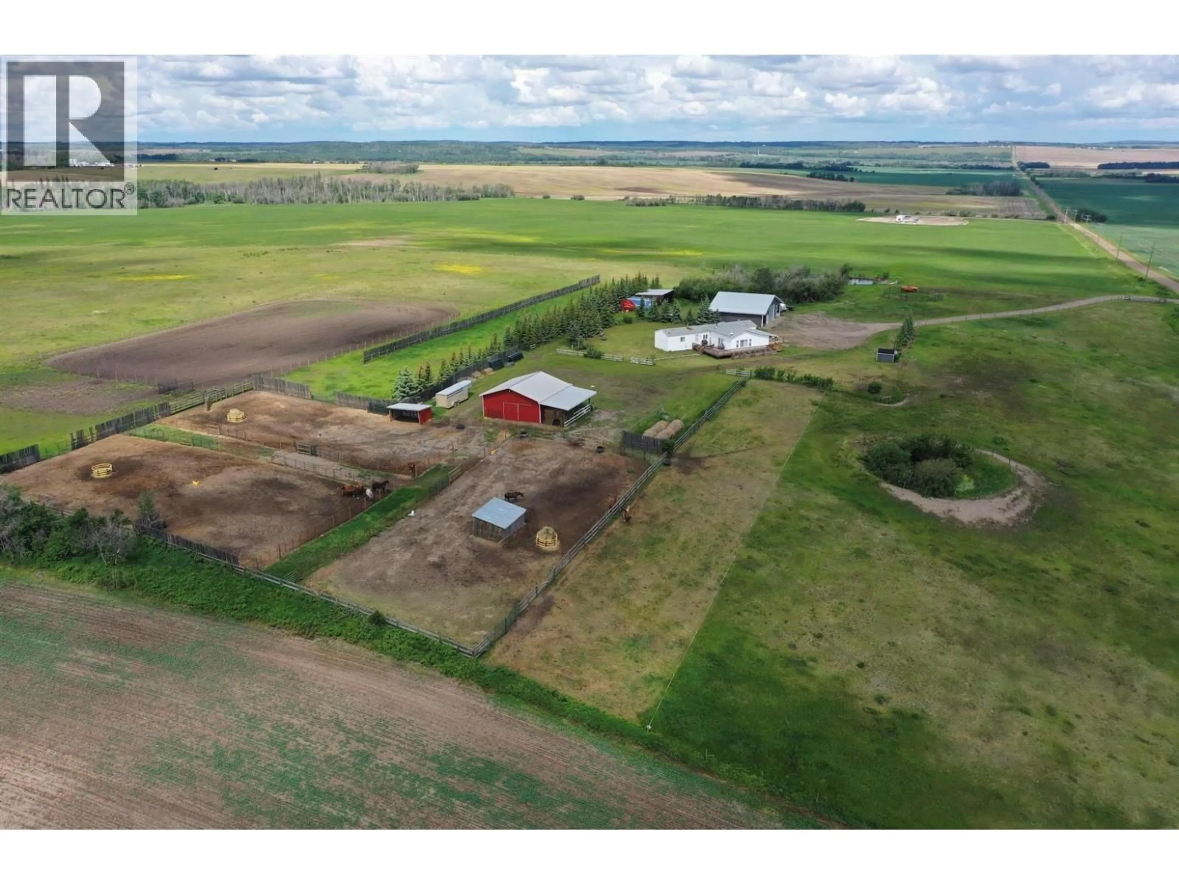 A pic from outside/outdoor area/front of a property/back of a property/a pic from drone, building for 5883 217 ROAD, Dawson Creek British Columbia V1G0A8