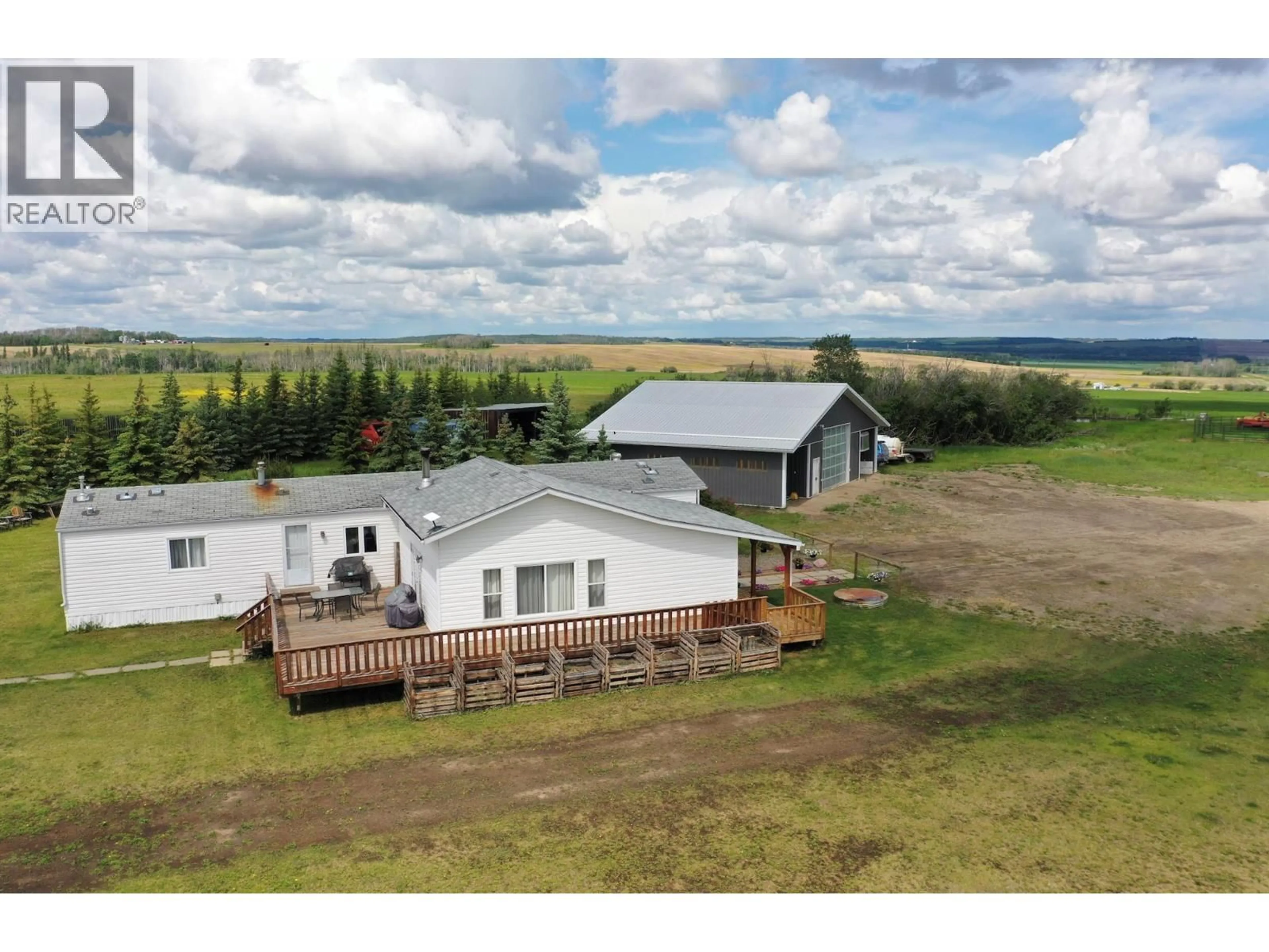 A pic from outside/outdoor area/front of a property/back of a property/a pic from drone, building for 5883 217 ROAD, Dawson Creek British Columbia V1G0A8