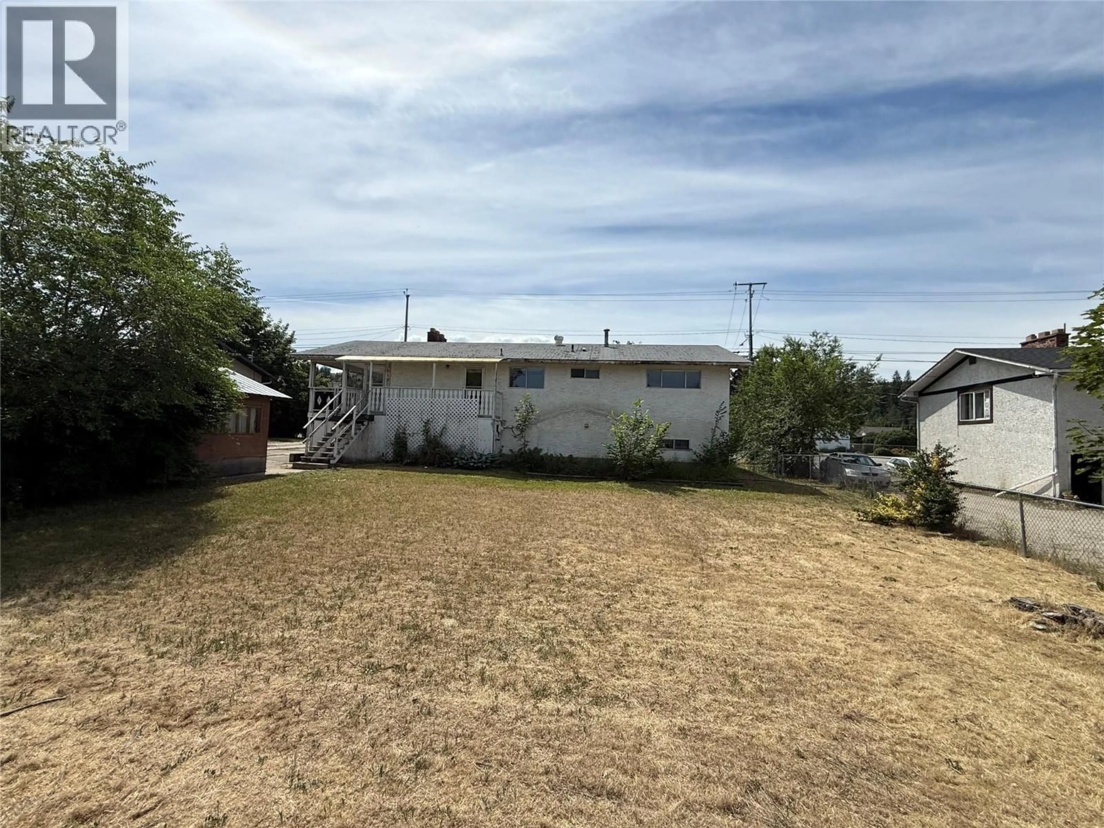 A pic from outside/outdoor area/front of a property/back of a property/a pic from drone, street for 2848 SPRINGFIELD ROAD, Kelowna British Columbia