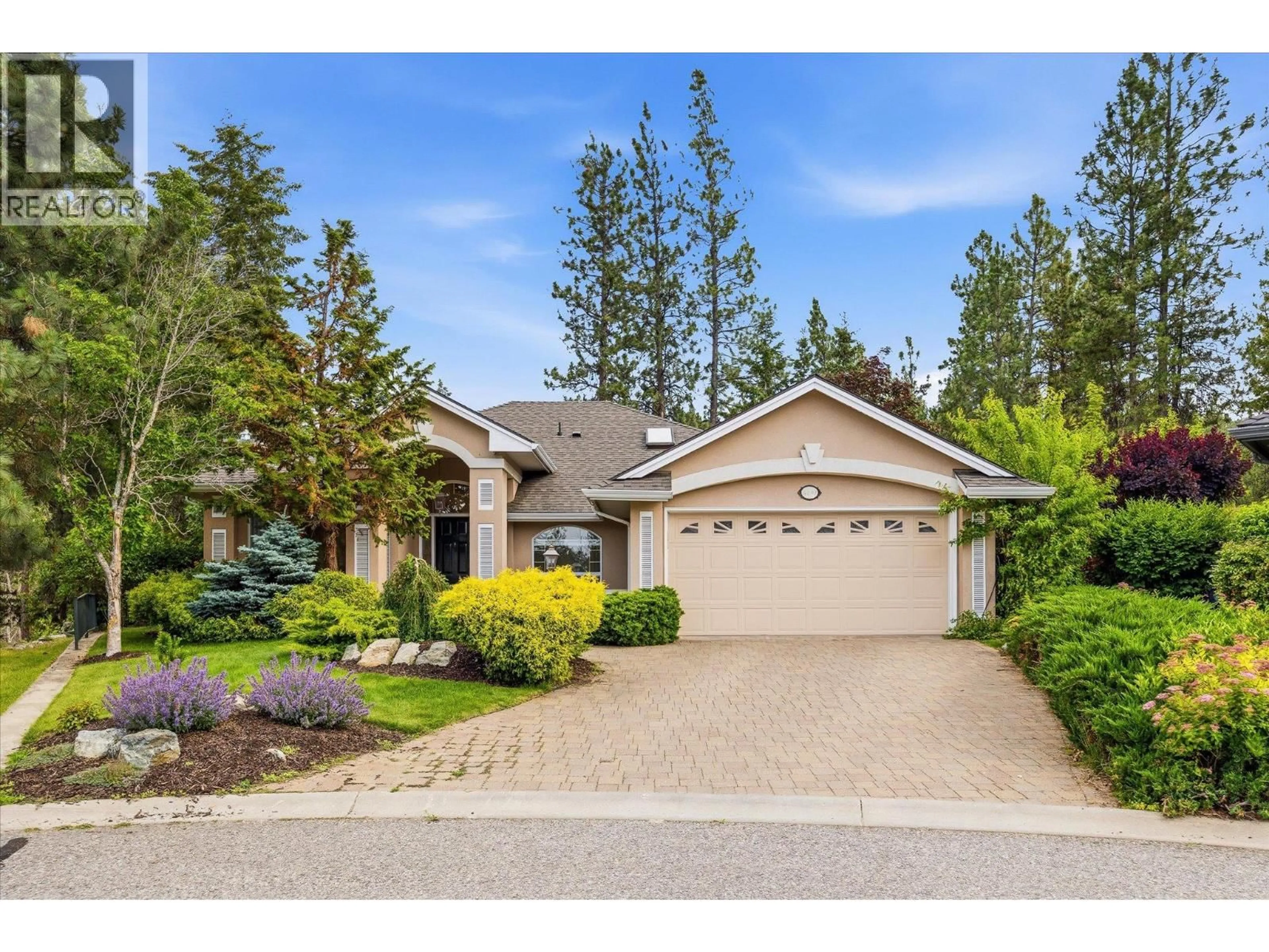 Home with vinyl exterior material, street for 4190 GALLAGHERS FOREST SOUTH, Kelowna British Columbia V1W5E4