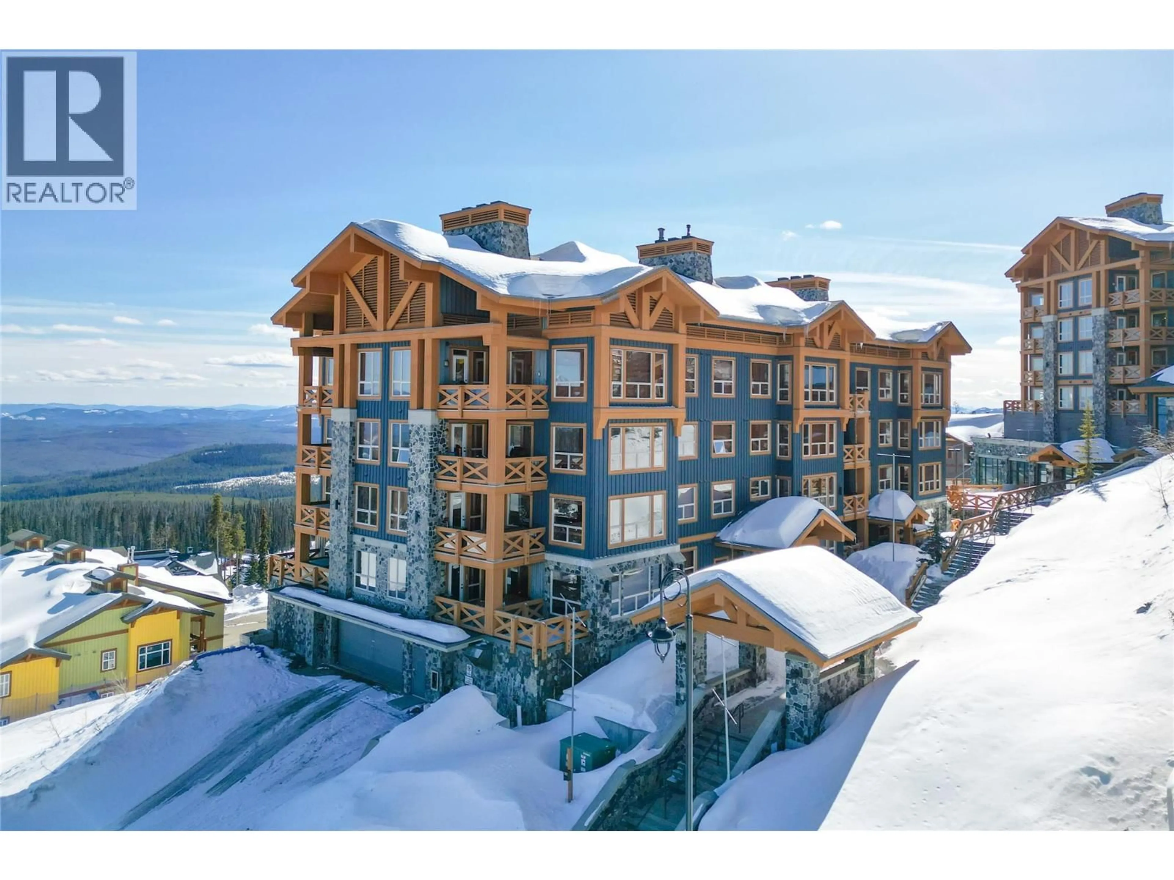 A pic from outside/outdoor area/front of a property/back of a property/a pic from drone, mountain view for 101C - 375 RAVEN RIDGE ROAD, Big White British Columbia V1P1P3