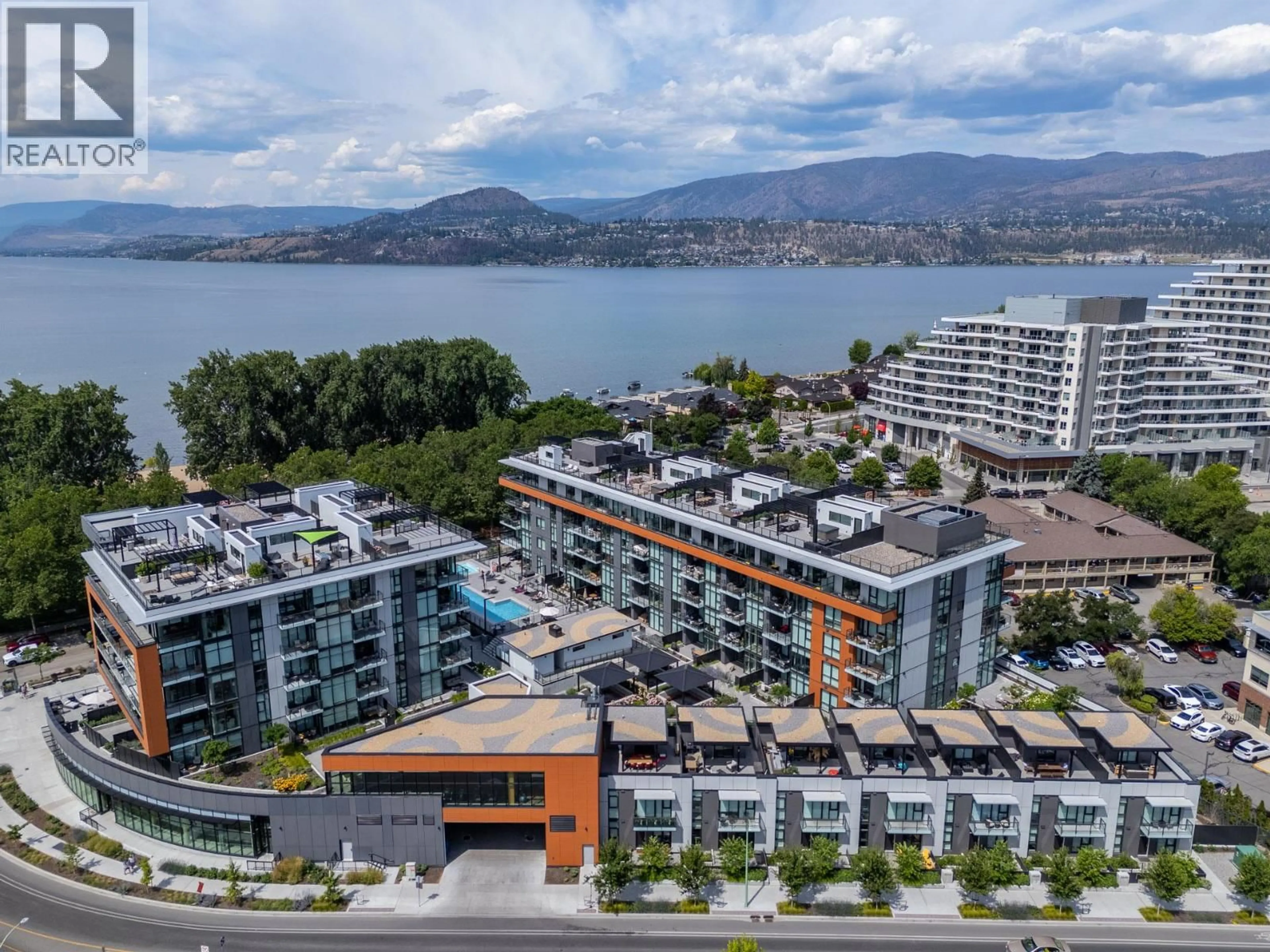 A pic from outside/outdoor area/front of a property/back of a property/a pic from drone, water/lake/river/ocean view for 407 - 3389 LAKESHORE ROAD, Kelowna British Columbia V1W3S9