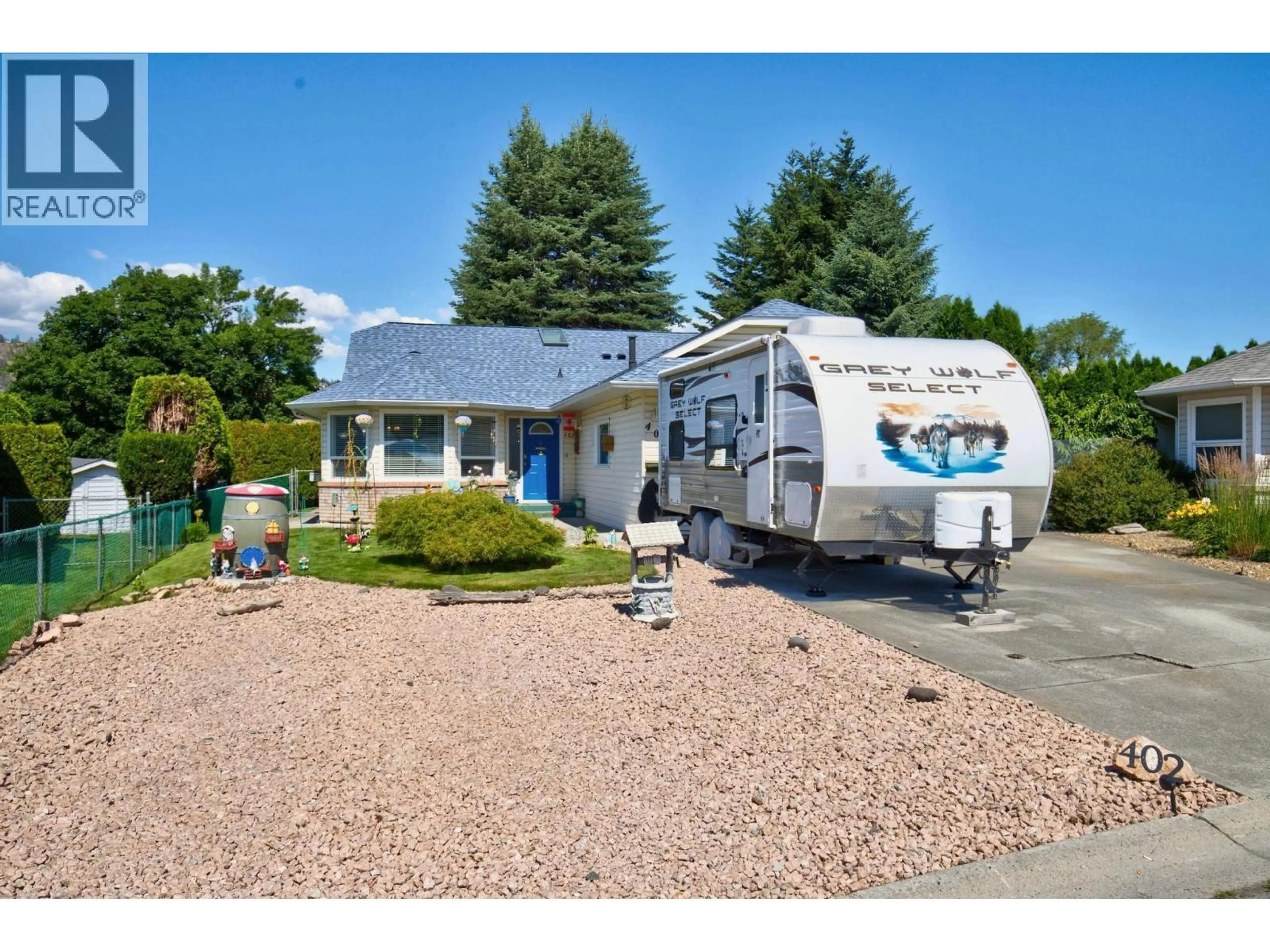 Home with vinyl exterior material, street for 402 HOUGHTON COURT, Kelowna British Columbia V1X7C7