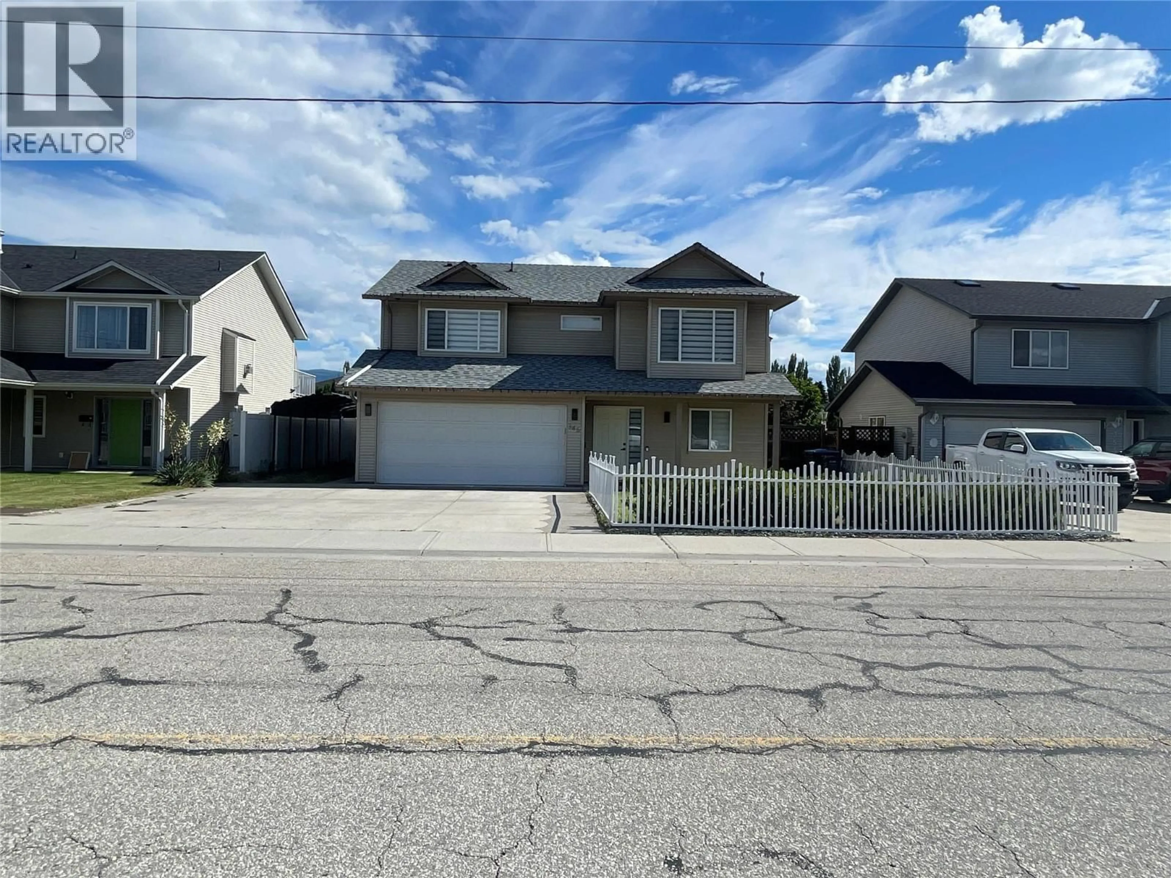 Home with vinyl exterior material, street for 345 FITZPATRICK ROAD, Kelowna British Columbia V1X5C8
