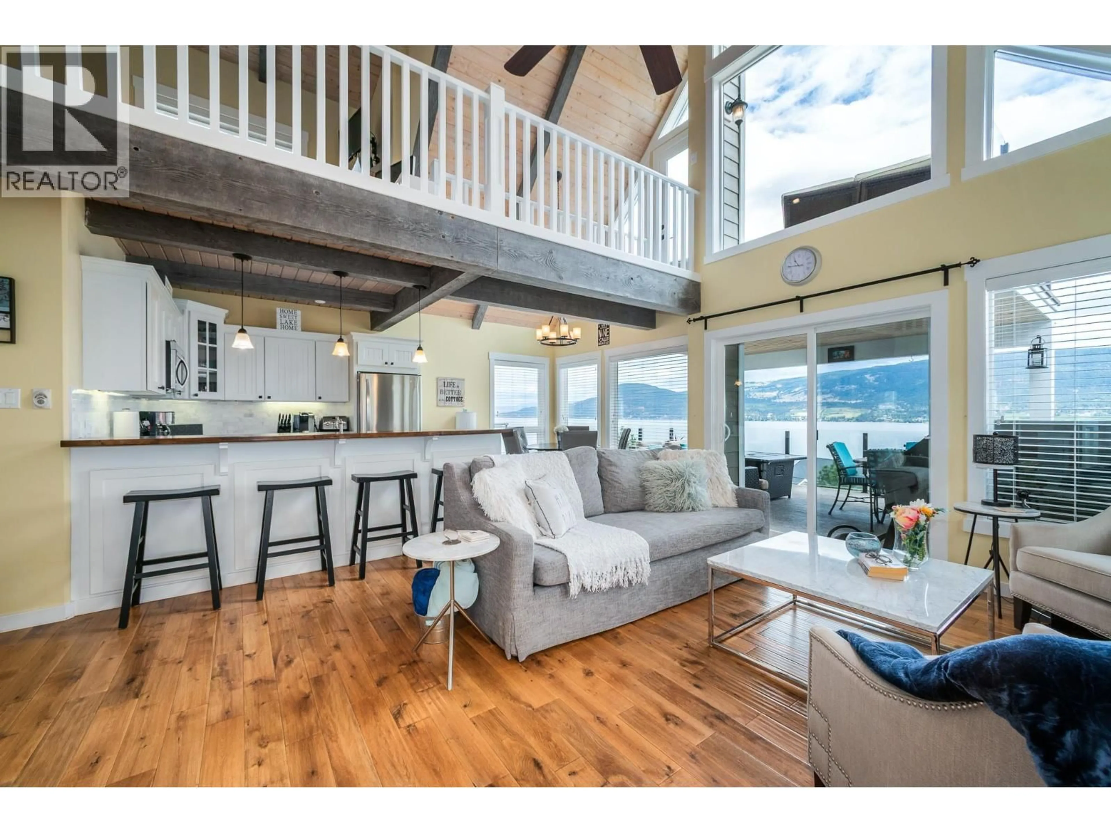 Open concept kitchen, wood/laminate floor for 6877 SANTIAGO LOOP, Fintry British Columbia V1Z3R8