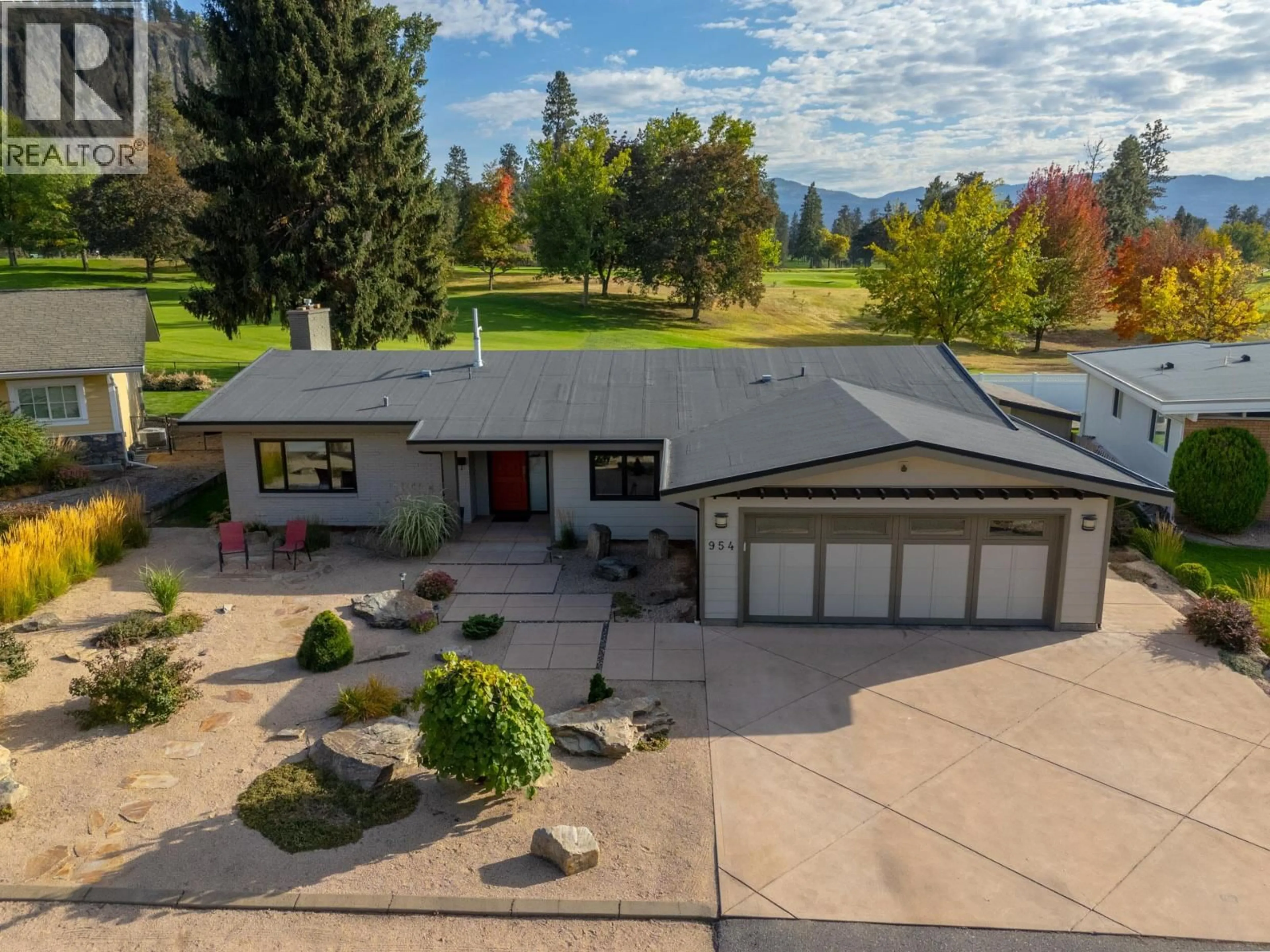 A pic from outside/outdoor area/front of a property/back of a property/a pic from drone, mountain view for 954 FAIRWAY CRESCENT, Kelowna British Columbia V1Y4S7