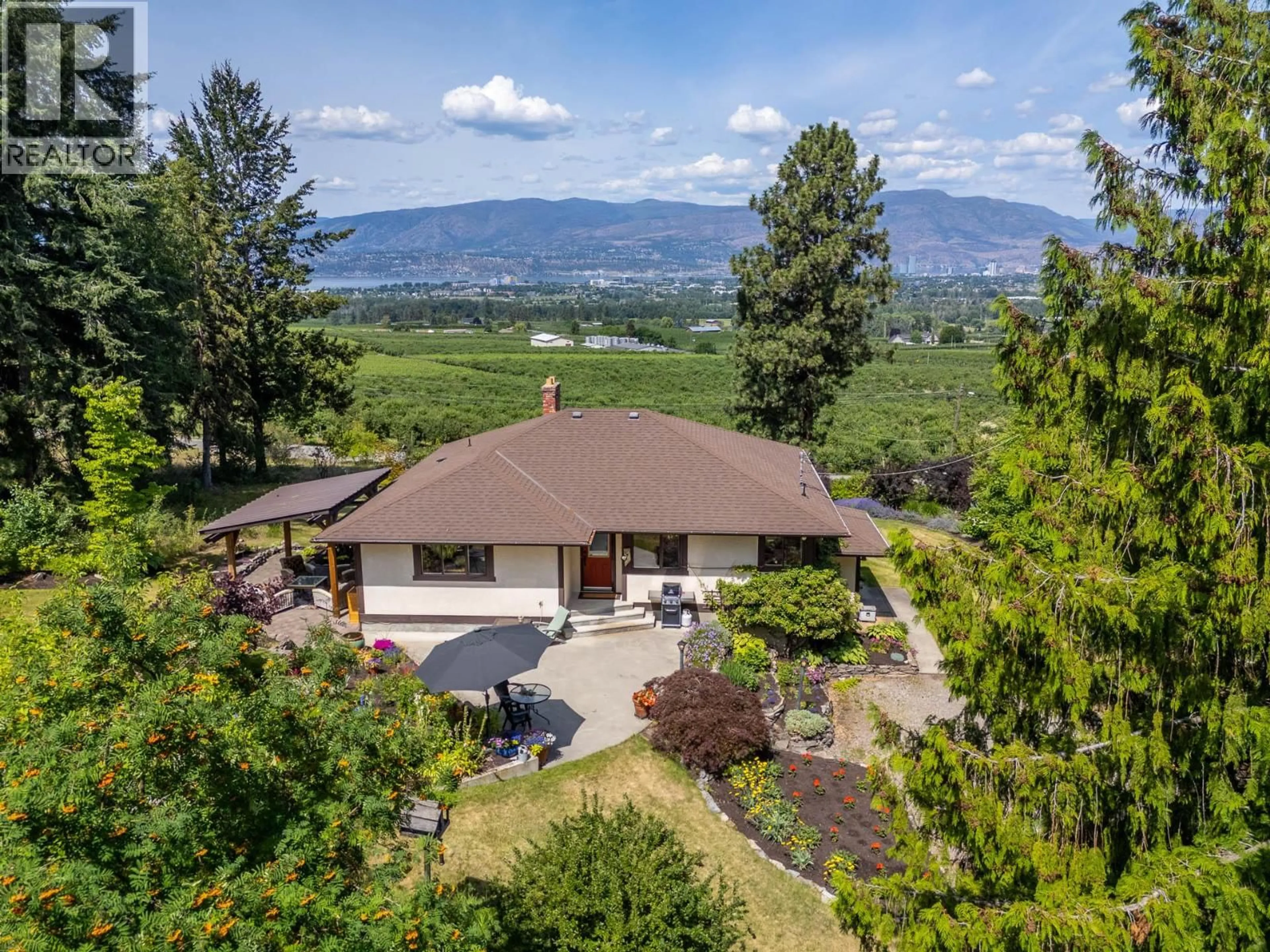 A pic from outside/outdoor area/front of a property/back of a property/a pic from drone, mountain view for 3885 SPIERS ROAD, Kelowna British Columbia V1W4B2