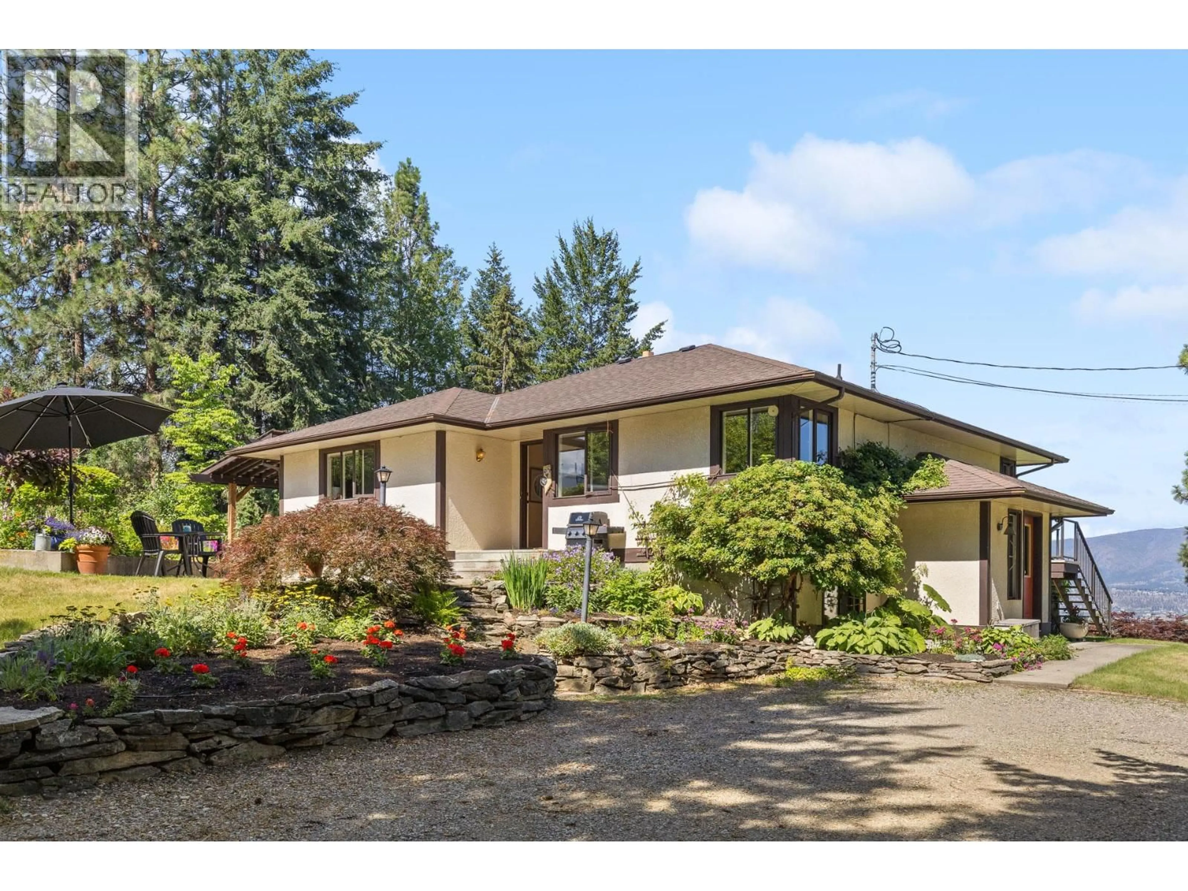 Home with vinyl exterior material, street for 3885 SPIERS ROAD, Kelowna British Columbia V1W4B2