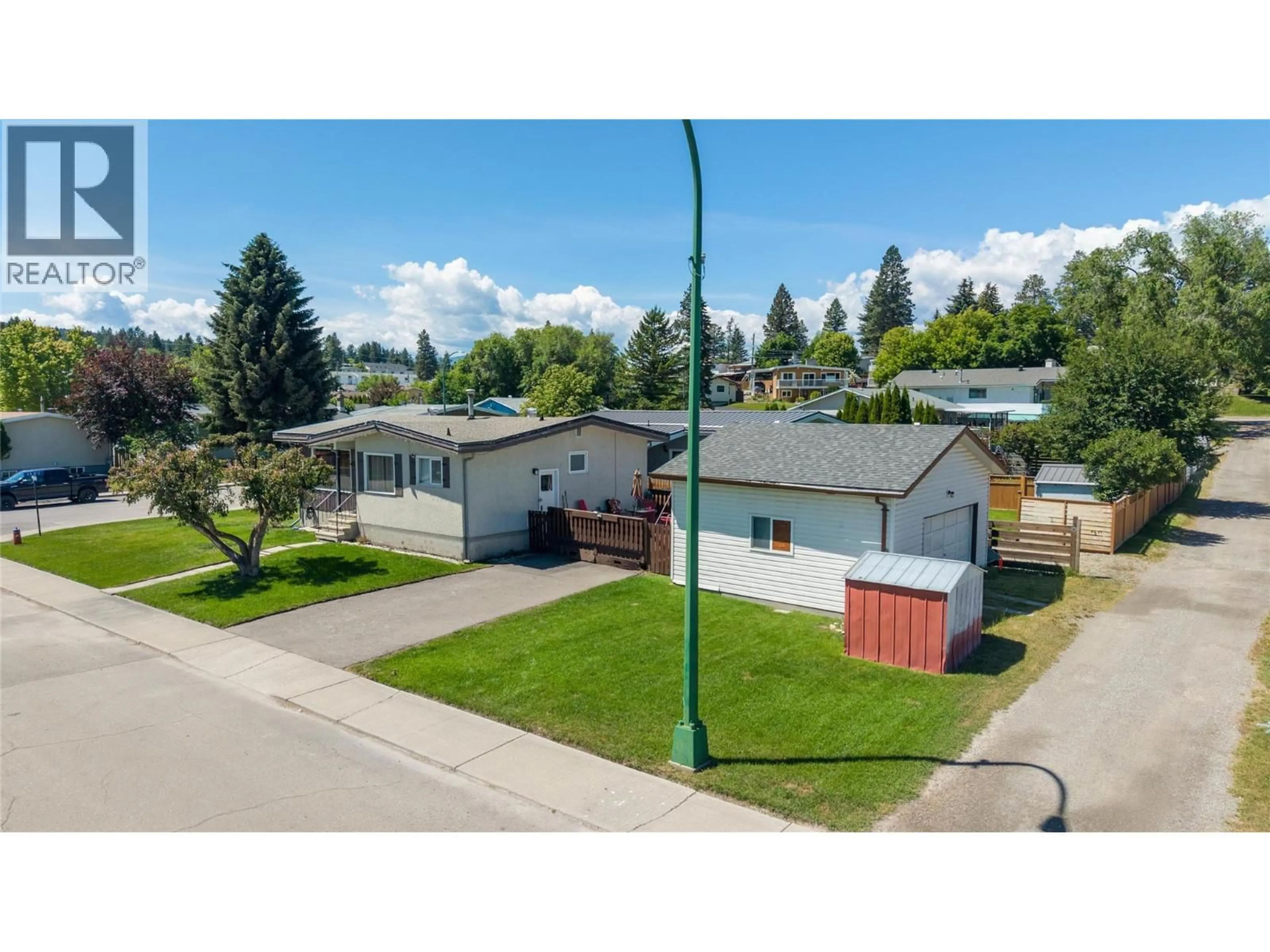 A pic from outside/outdoor area/front of a property/back of a property/a pic from drone, street for 1516 6A STREET SOUTH, Cranbrook British Columbia V1C4J1