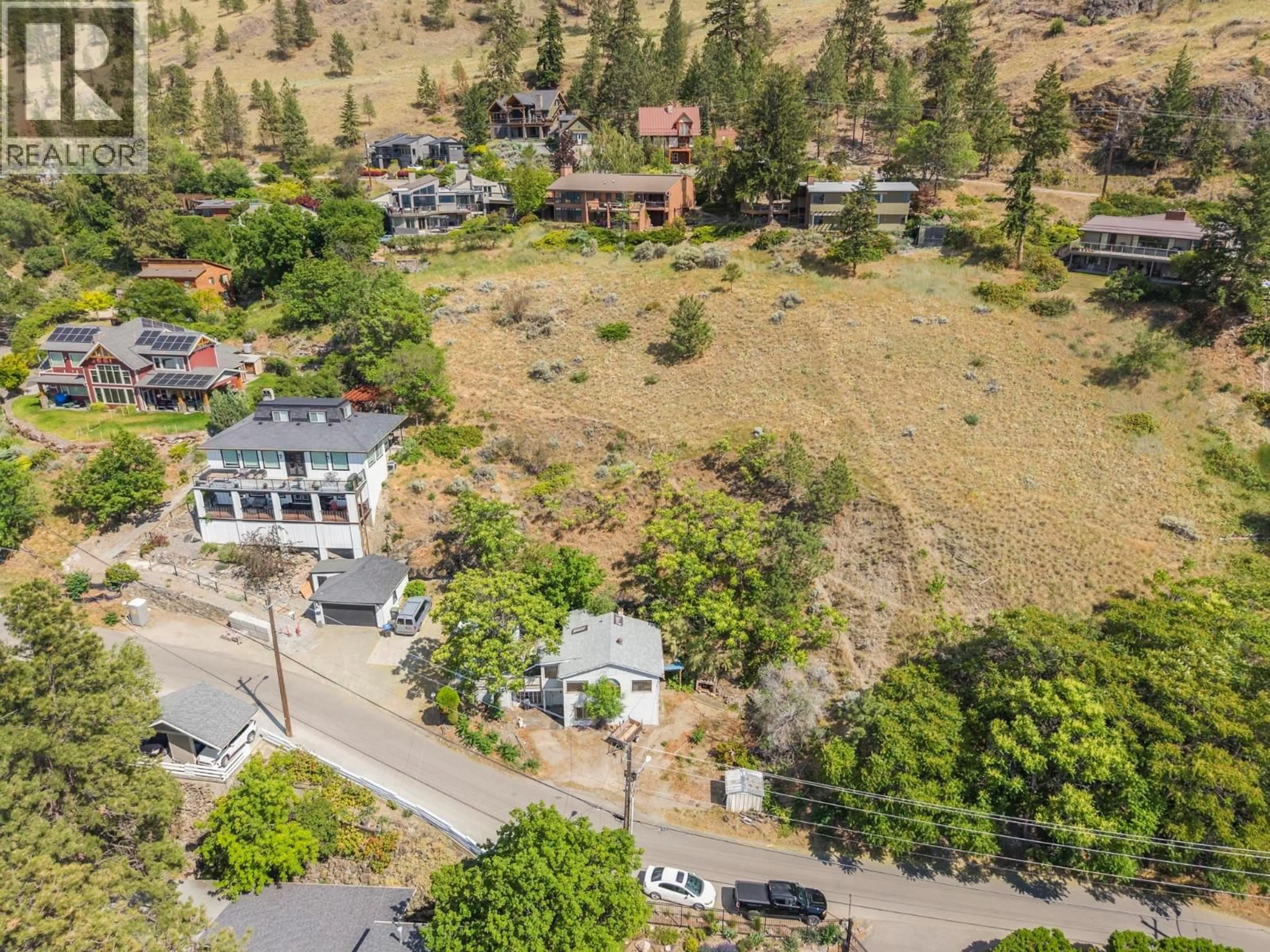 A pic from outside/outdoor area/front of a property/back of a property/a pic from drone, mountain view for 345 POPLAR POINT DRIVE, Kelowna British Columbia V1Y1Y2