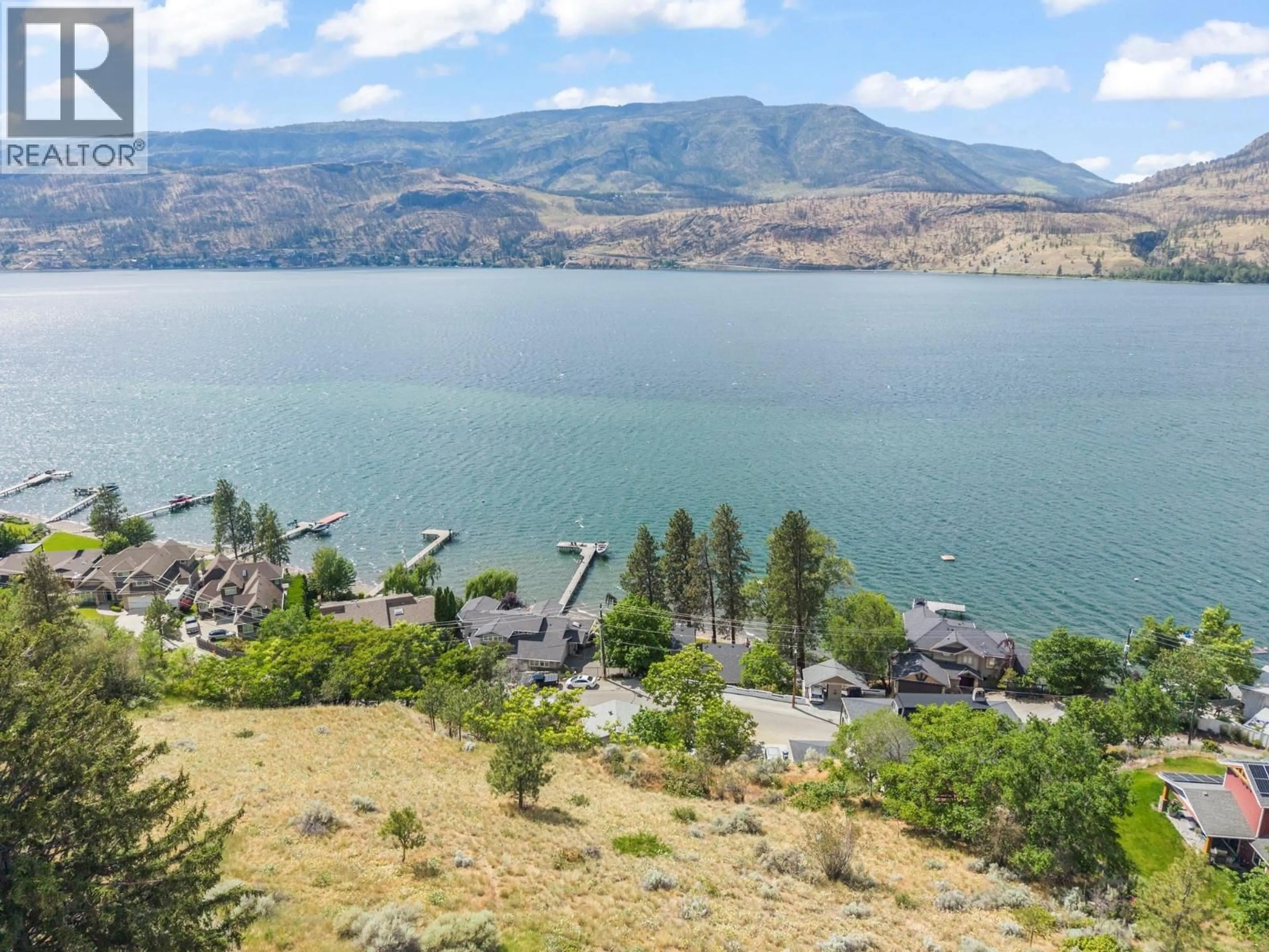 A pic from outside/outdoor area/front of a property/back of a property/a pic from drone, water/lake/river/ocean view for 345 POPLAR POINT DRIVE, Kelowna British Columbia V1Y1Y2