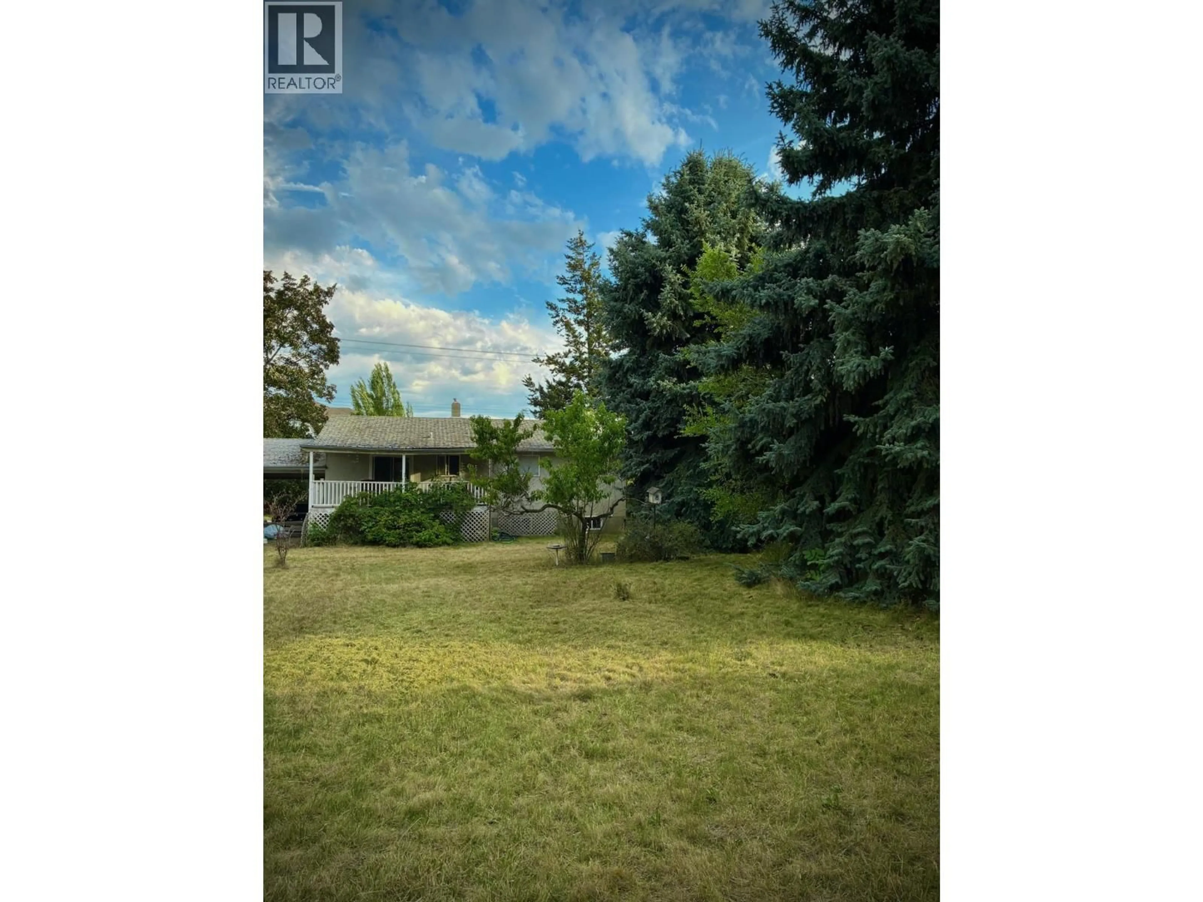 A pic from outside/outdoor area/front of a property/back of a property/a pic from drone, forest/trees view for 1220 K.L.O ROAD, Kelowna British Columbia V1W3P9