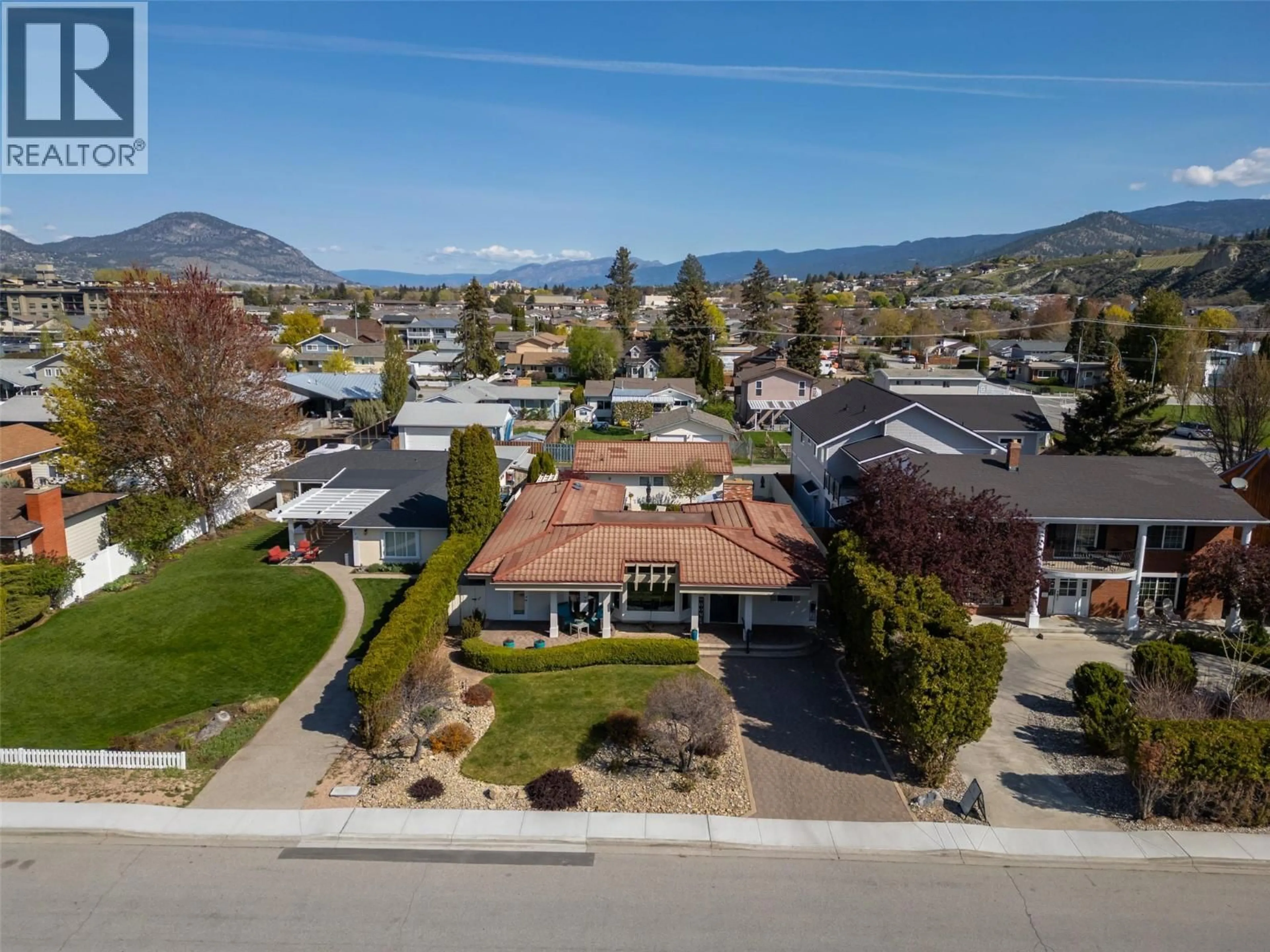 A pic from outside/outdoor area/front of a property/back of a property/a pic from drone, mountain view for 115 ELM AVENUE, Penticton British Columbia V2A3W1