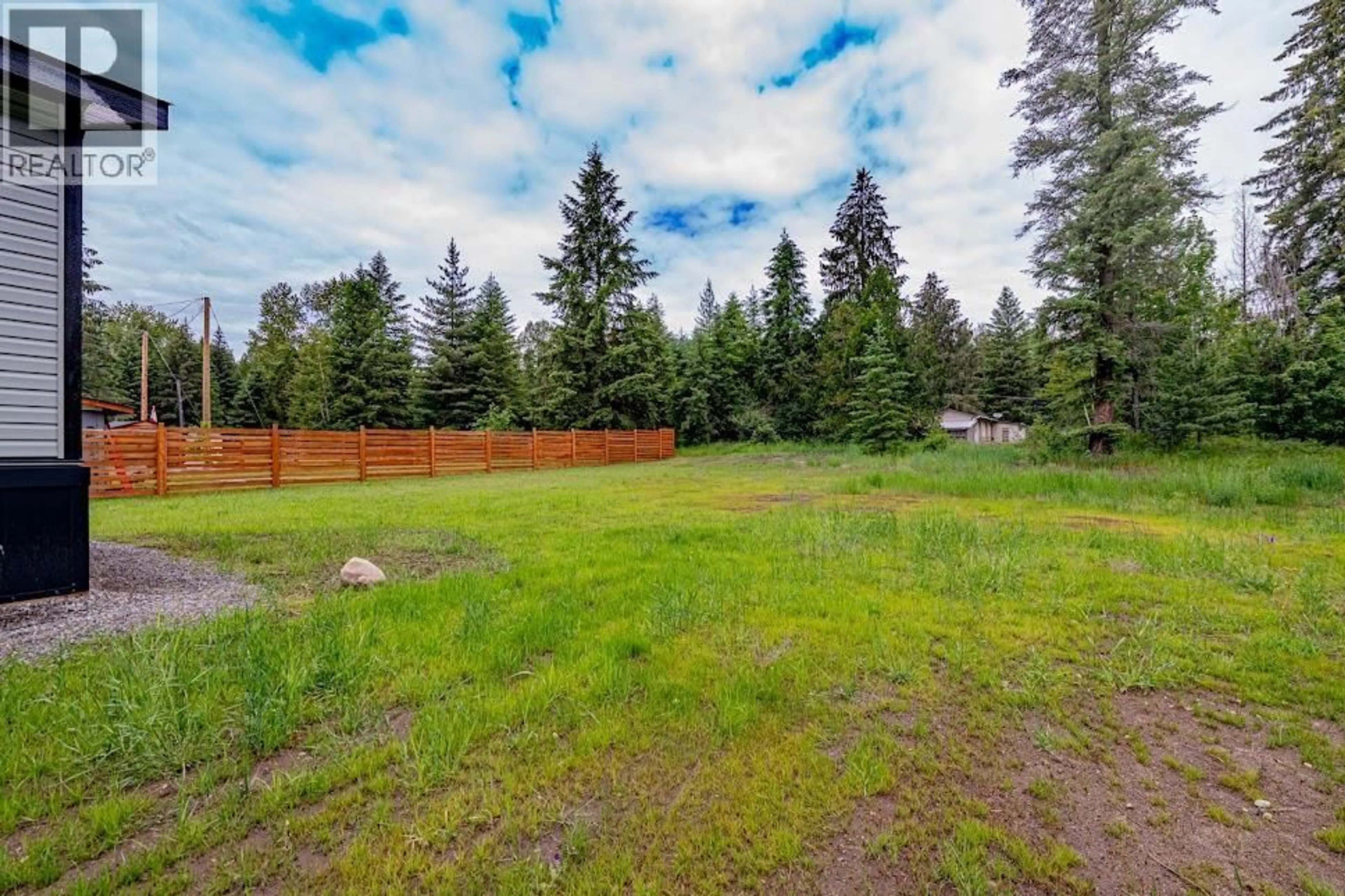 A pic from outside/outdoor area/front of a property/back of a property/a pic from drone, forest/trees view for 7 - 916 AIRPORT ROAD, Salmo British Columbia