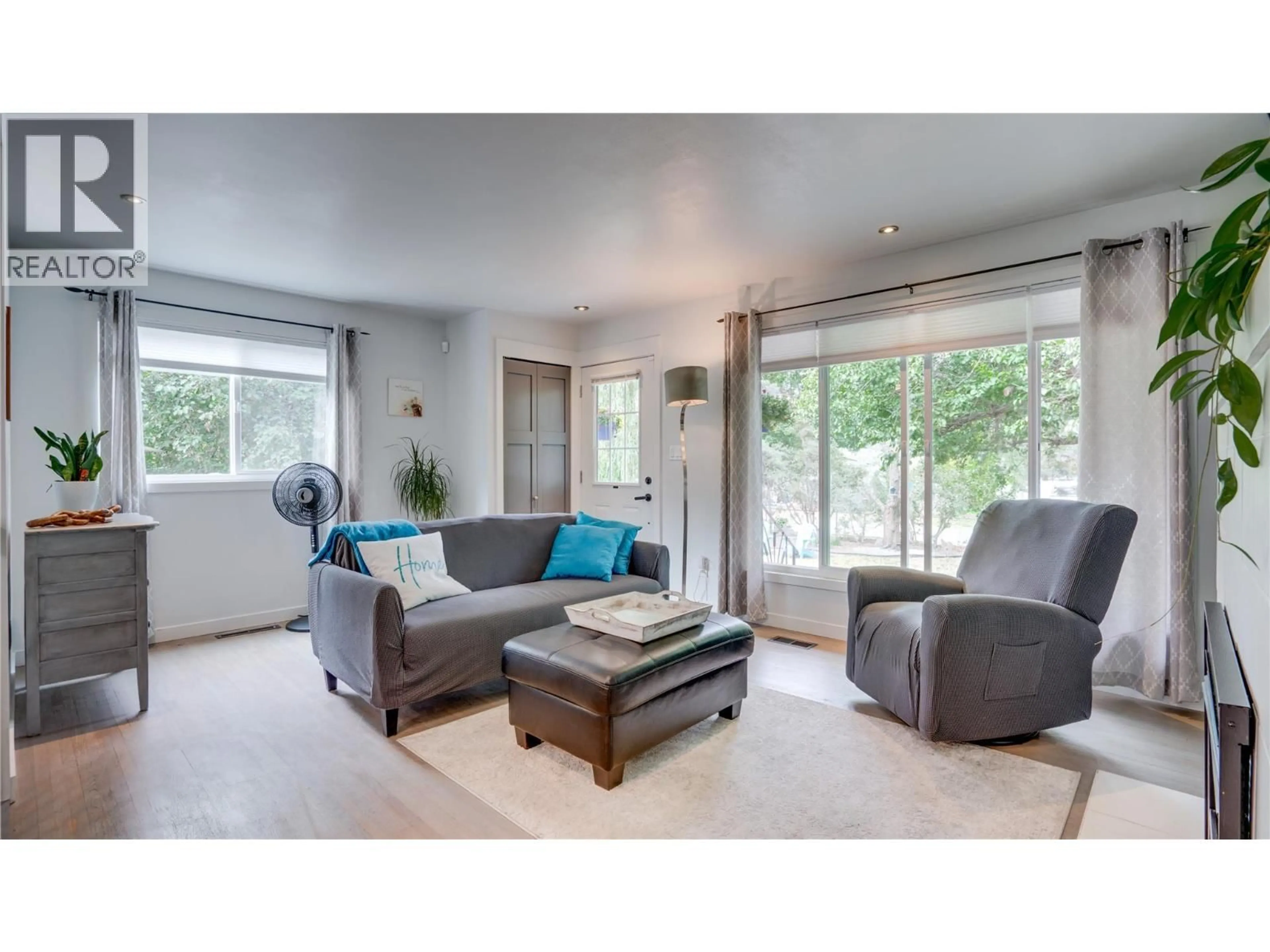 Living room with furniture, wood/laminate floor for 4601 17 STREET, Vernon British Columbia V1B3C5