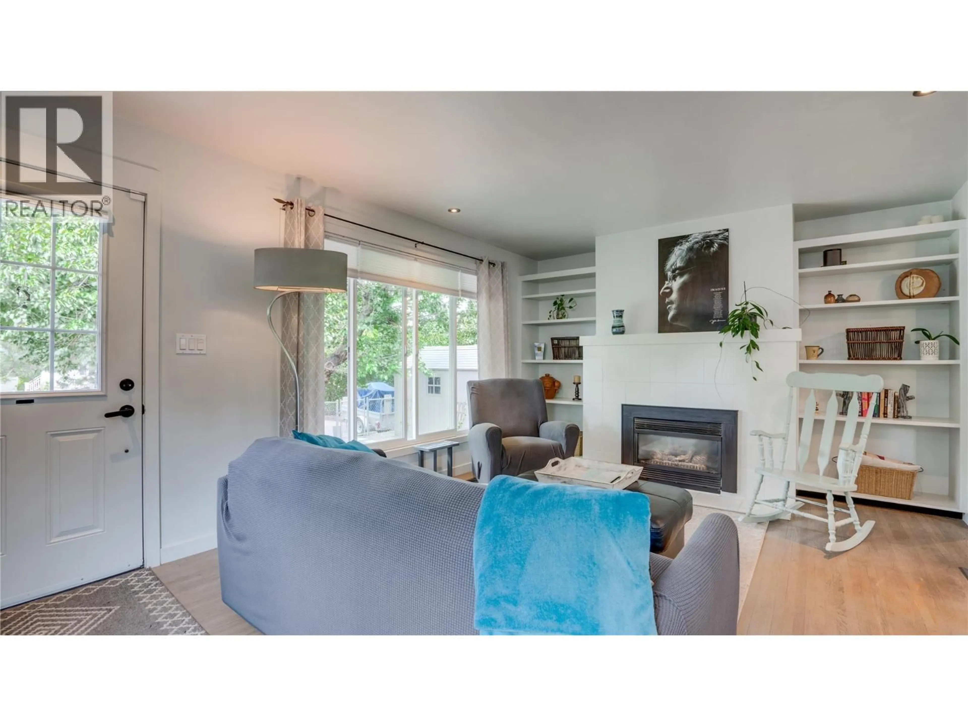 Living room with furniture, wood/laminate floor for 4601 17 STREET, Vernon British Columbia V1B3C5