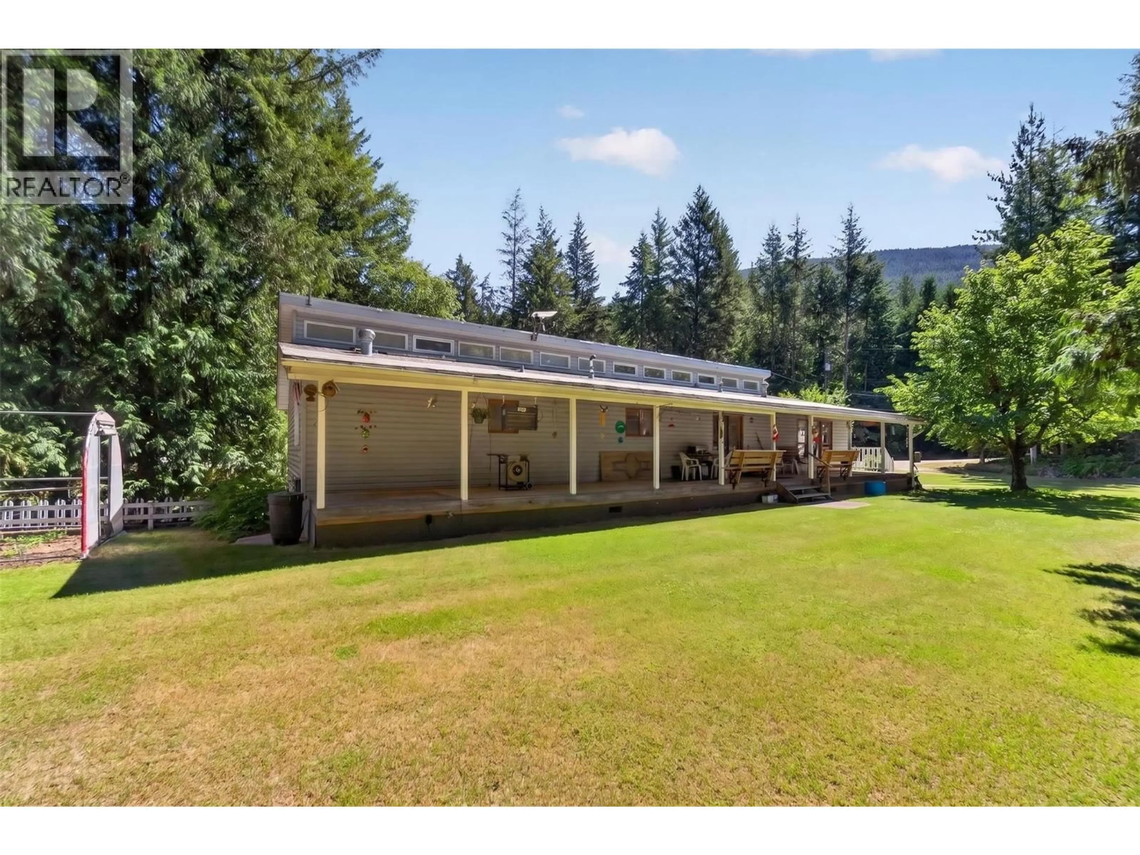 A pic from outside/outdoor area/front of a property/back of a property/a pic from drone, mountain view for 8981 SWANSON ROAD, Swansea Point British Columbia V0E2K2