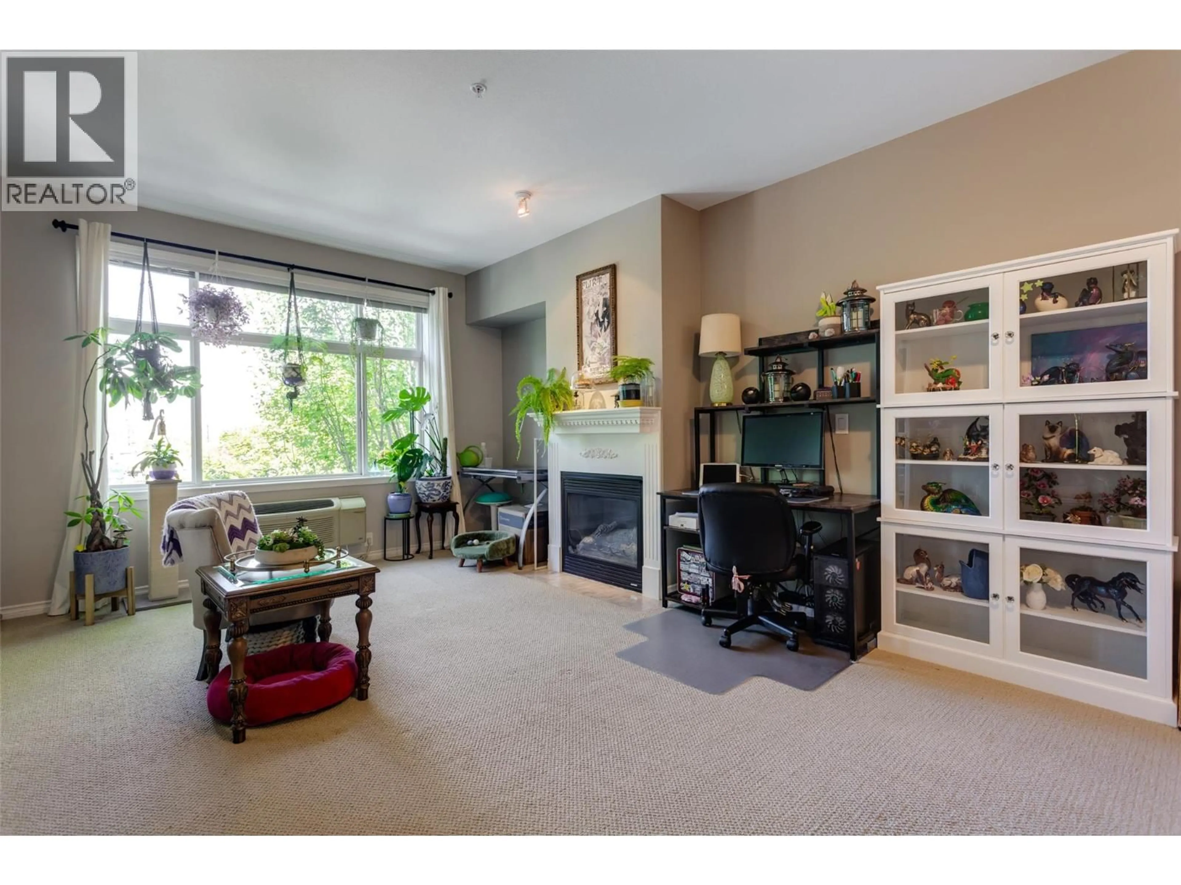Living room with furniture, unknown for 201 - 1235 KLO ROAD, Kelowna British Columbia V1W3N7
